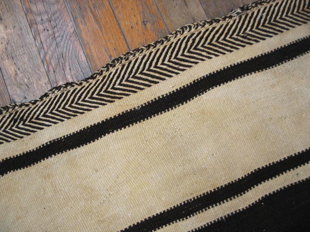 Early 20th Century Moroccan Mixed Technique Flat-Weave & Pile carpet 
This is a flat weave ivory and brown striped Moroccan Kilim rug. The piece was handmade with fine wool in the 1920s.
( 5'4