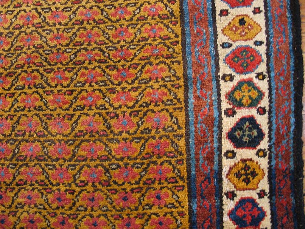 Handmade antique NW Persian carpet.
 Bright yellow background with ivory and blue borders. Allover design with linear rows of flowers and leaves. Hand knotted wool construction.