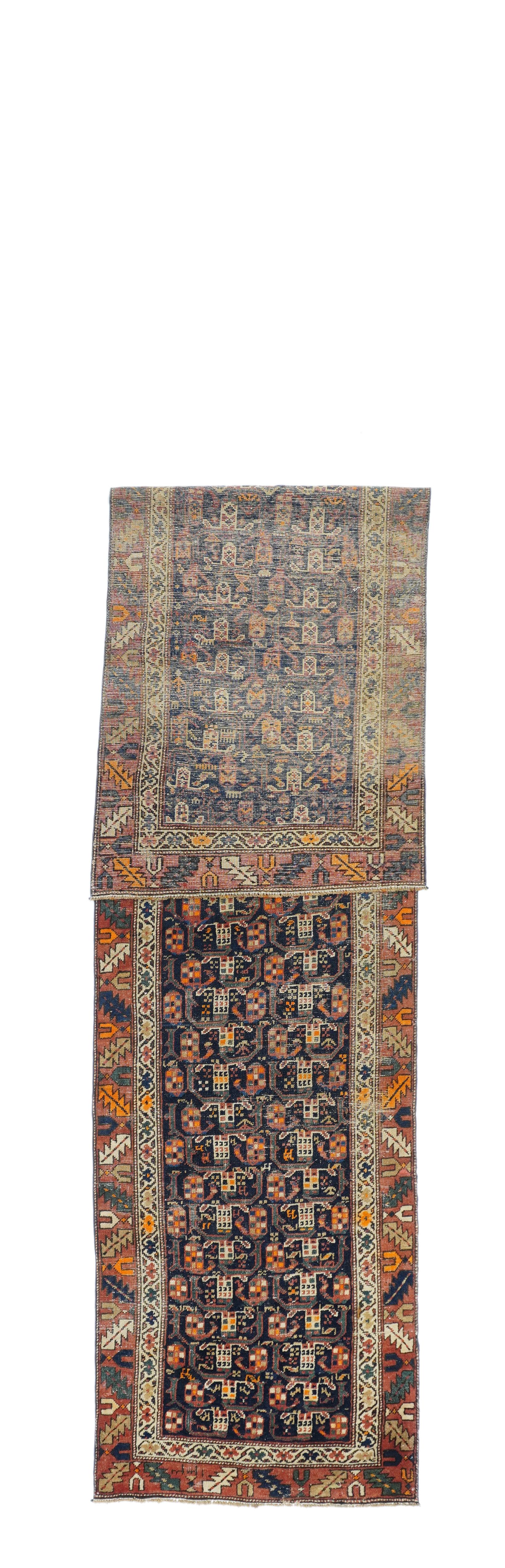 Antique North West Runner 2'11'' x 13'6''. The navy field displays two columns of beige baskets and polychromed botehs, with green curvy sterms. The red main border features a Caucasian-style slanted leaf and calyx patter. Inner ecru border with