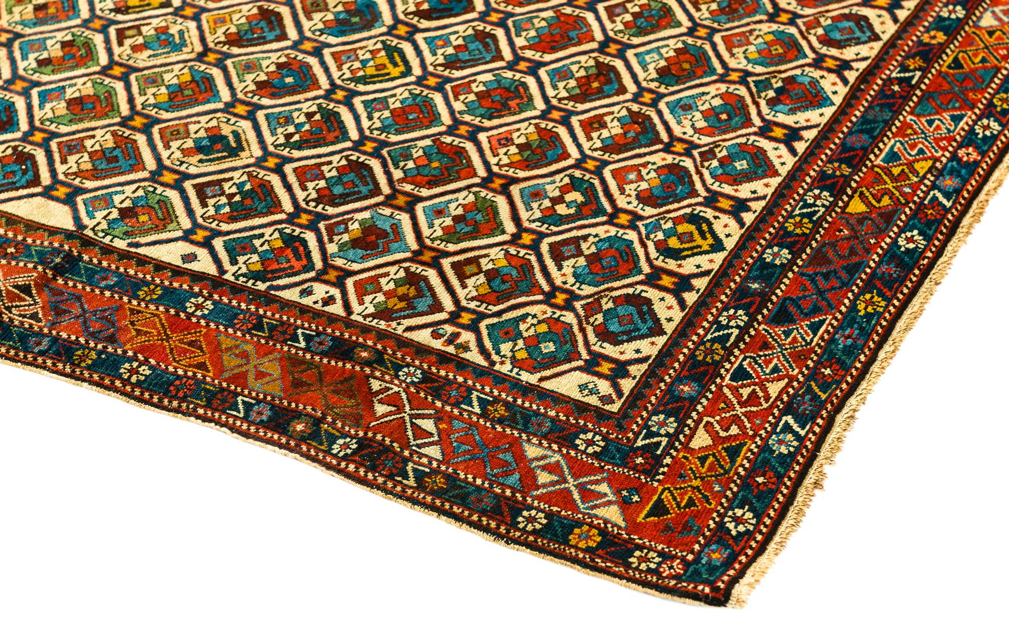 Antique Northeastern Caucasian Shirvan Prayer Rug woven circa 1870.  Geometric and floral design arranged within a honeycomb lattice pattern field. The multi colors create a visually pleasing design.  Size:  3'8 x 4'3