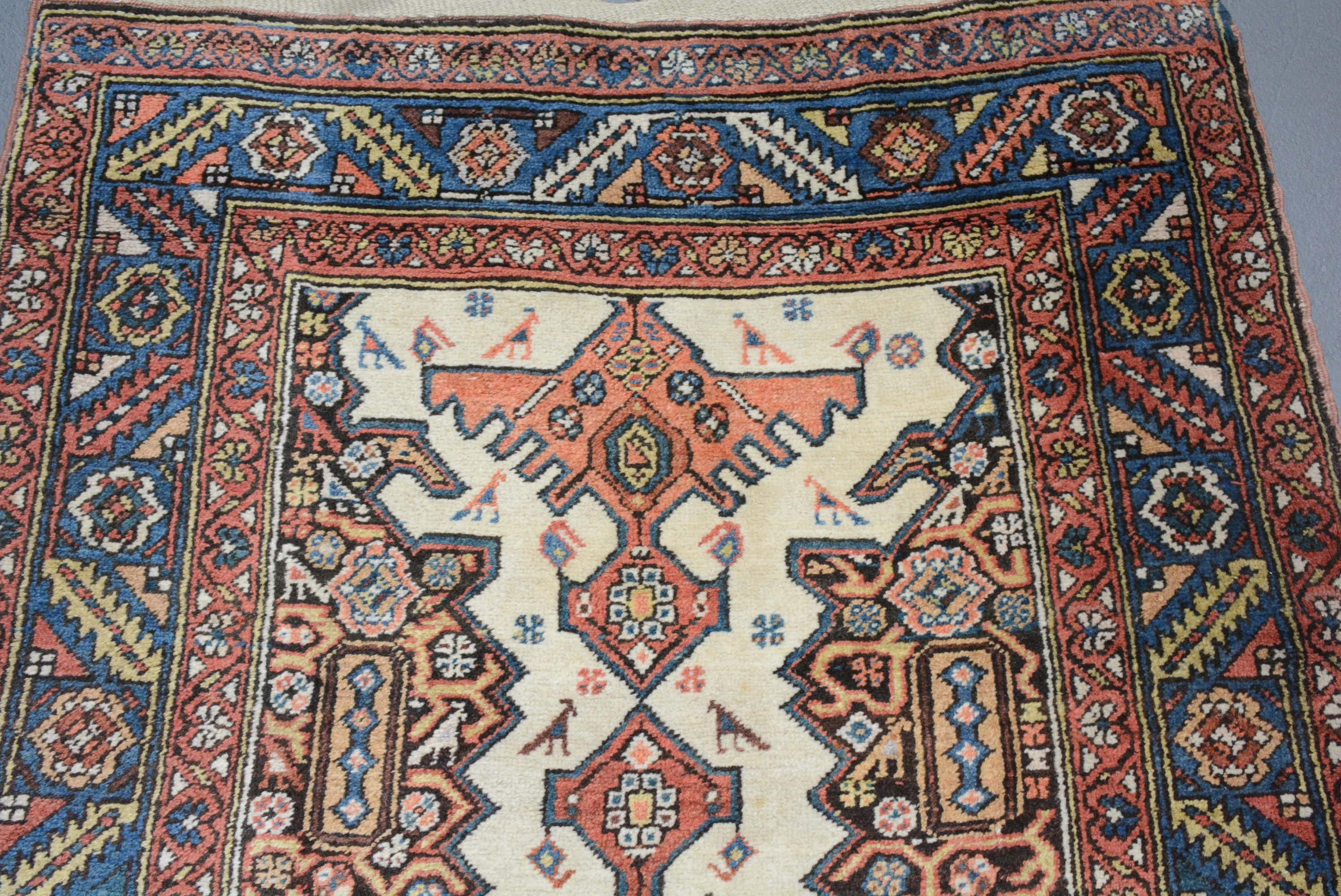 The town of Bakshaish is located in the mountainous Heriz region of Northwest Persia, and is generally accepted to be the oldest weaving village in this district. It is noted for producing carpets that display bold abstract interpretations of the