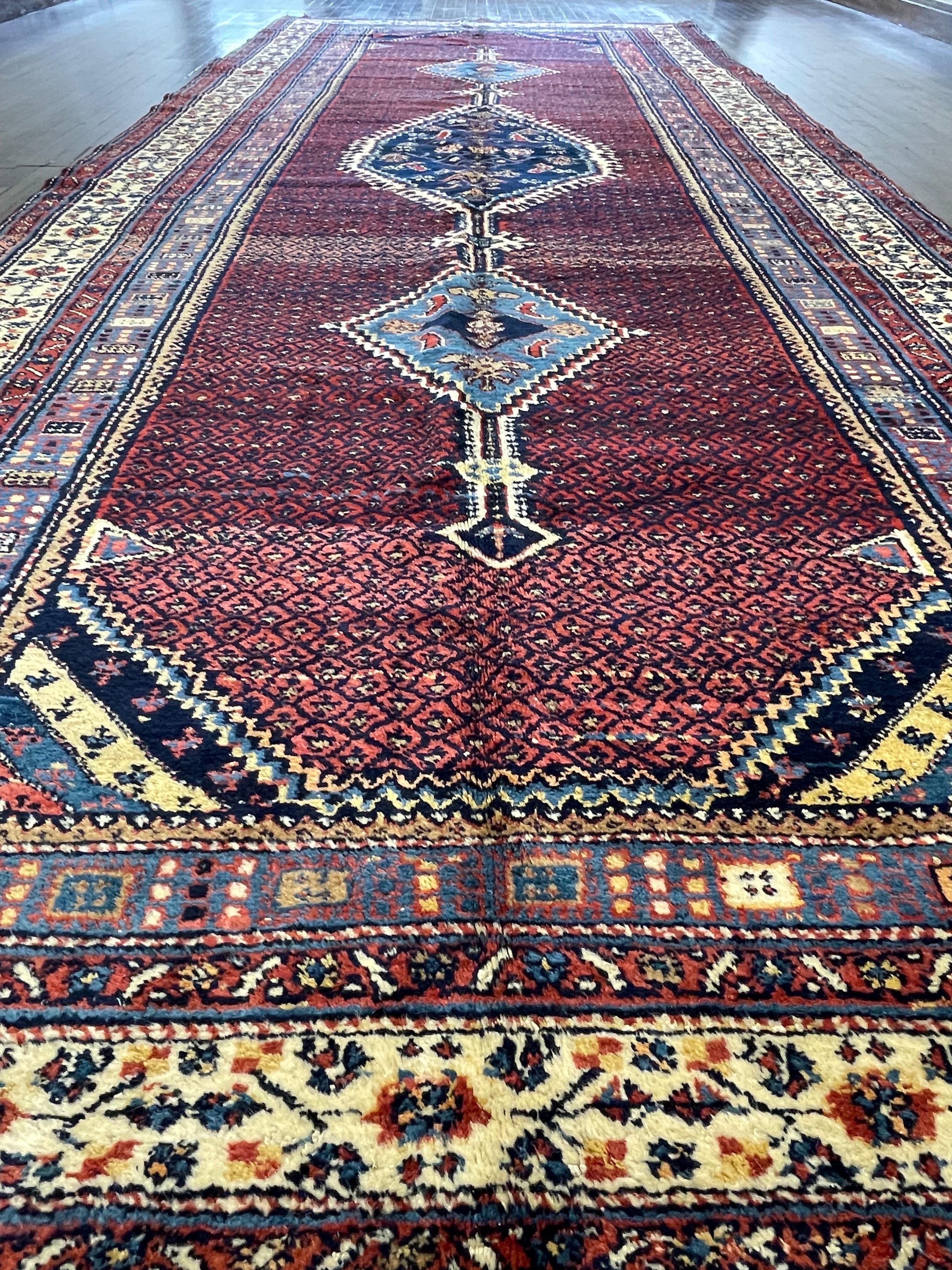 A fantastic northwest Persian corridor-Kalege- long and wide runner. This very unusual tribal persian piece is hand woven by a single weaver perhaps for a self use. The Primitive design of this rug suggest an unsupervised drawing either made to