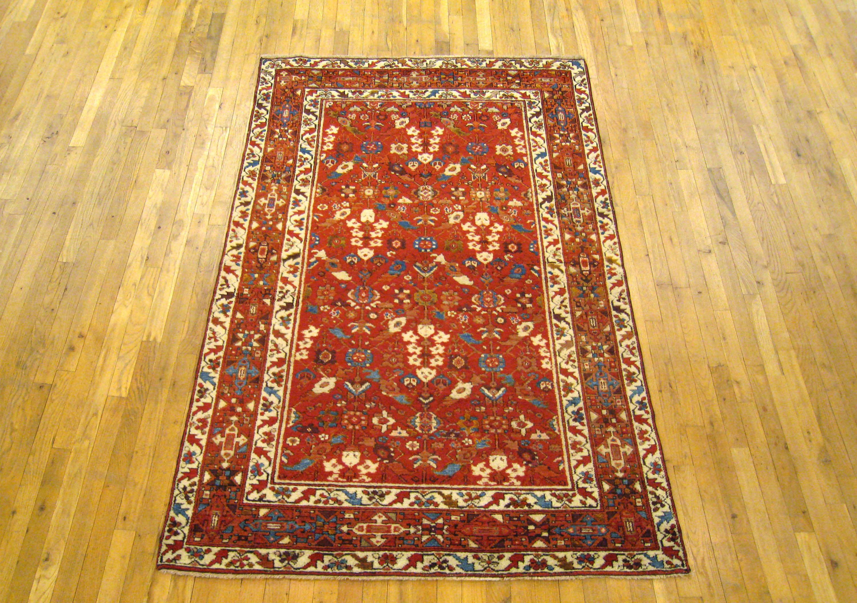 An antique N.W. Persian oriental carpet, size 6'9