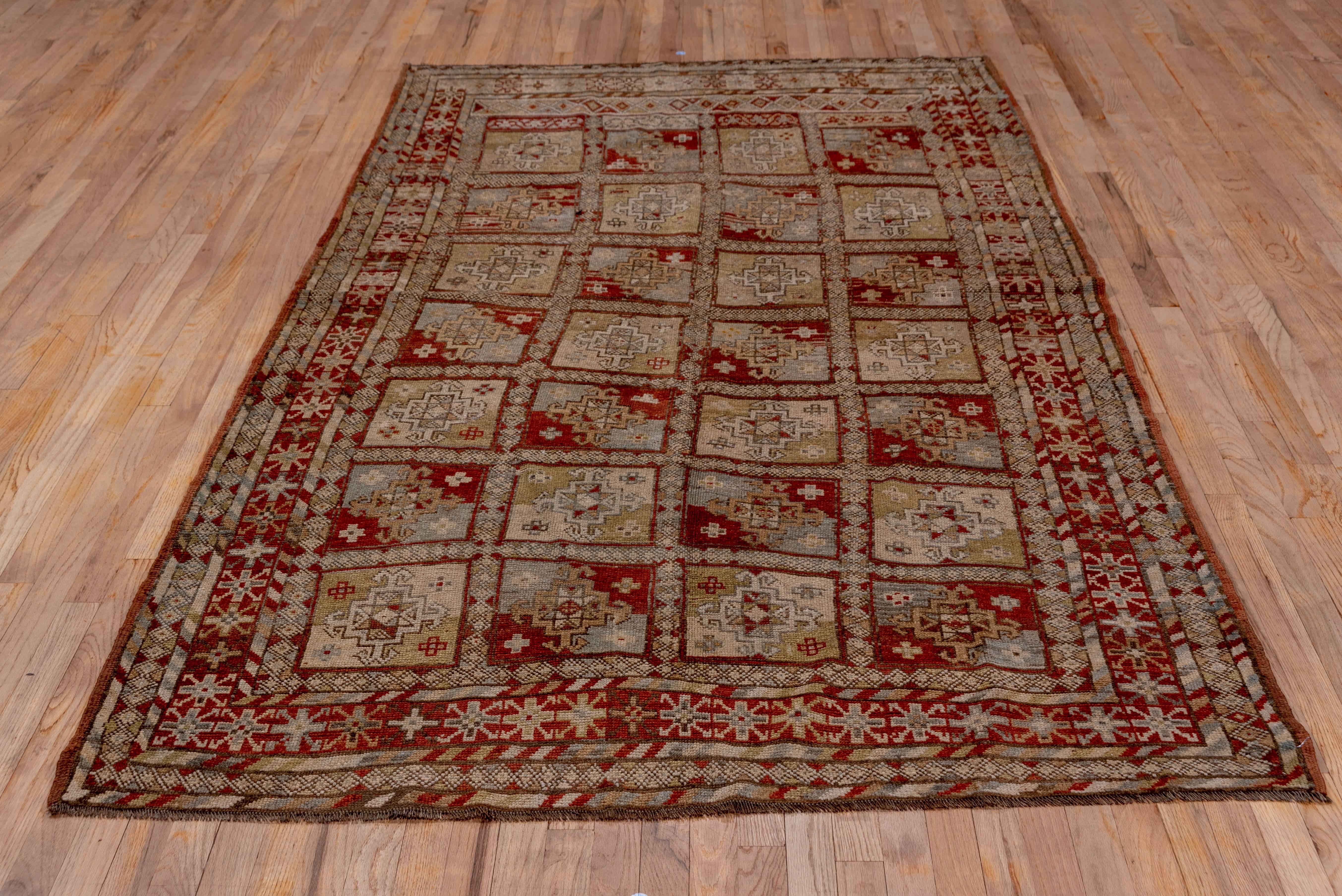 This antique Northwest Persian village rug has a plethora of influences in its design. The compartments of Belouchi influence with a Turkoman hooked morif.