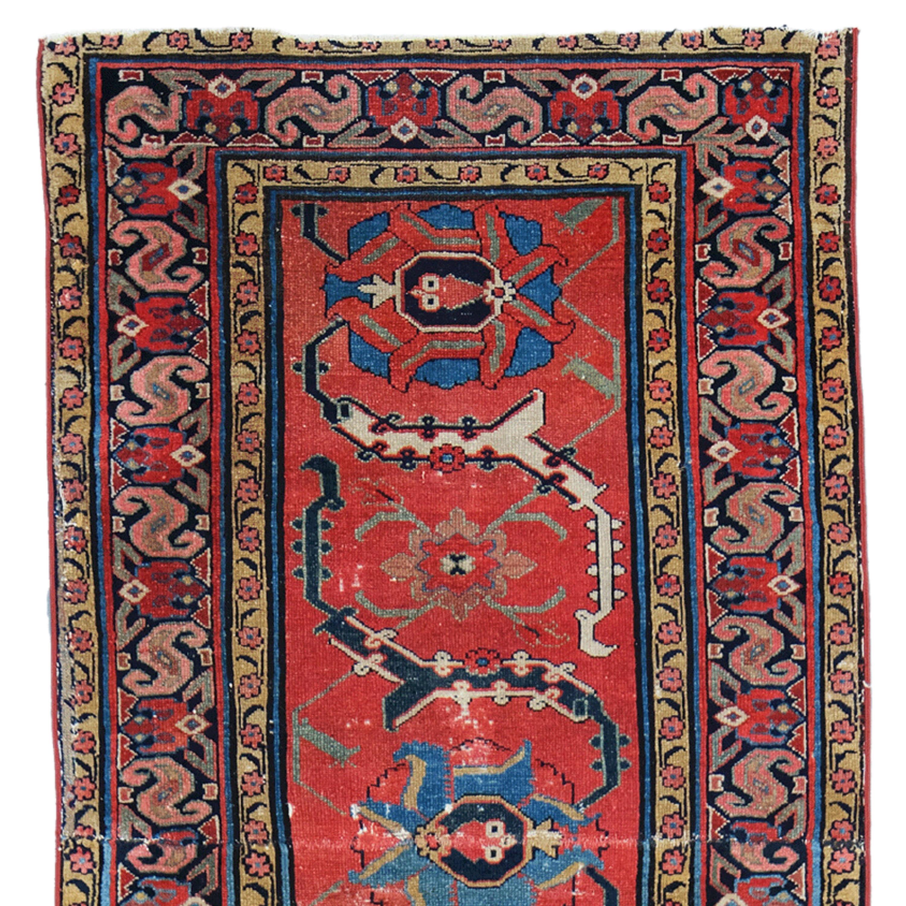 This elegant 19th-century Northwest runner is an example of the finest craftsmanship of its period. With its rich color palette and intricate patterns, this piece adds an authentic and sophisticated touch to any space. Although worn over the years,