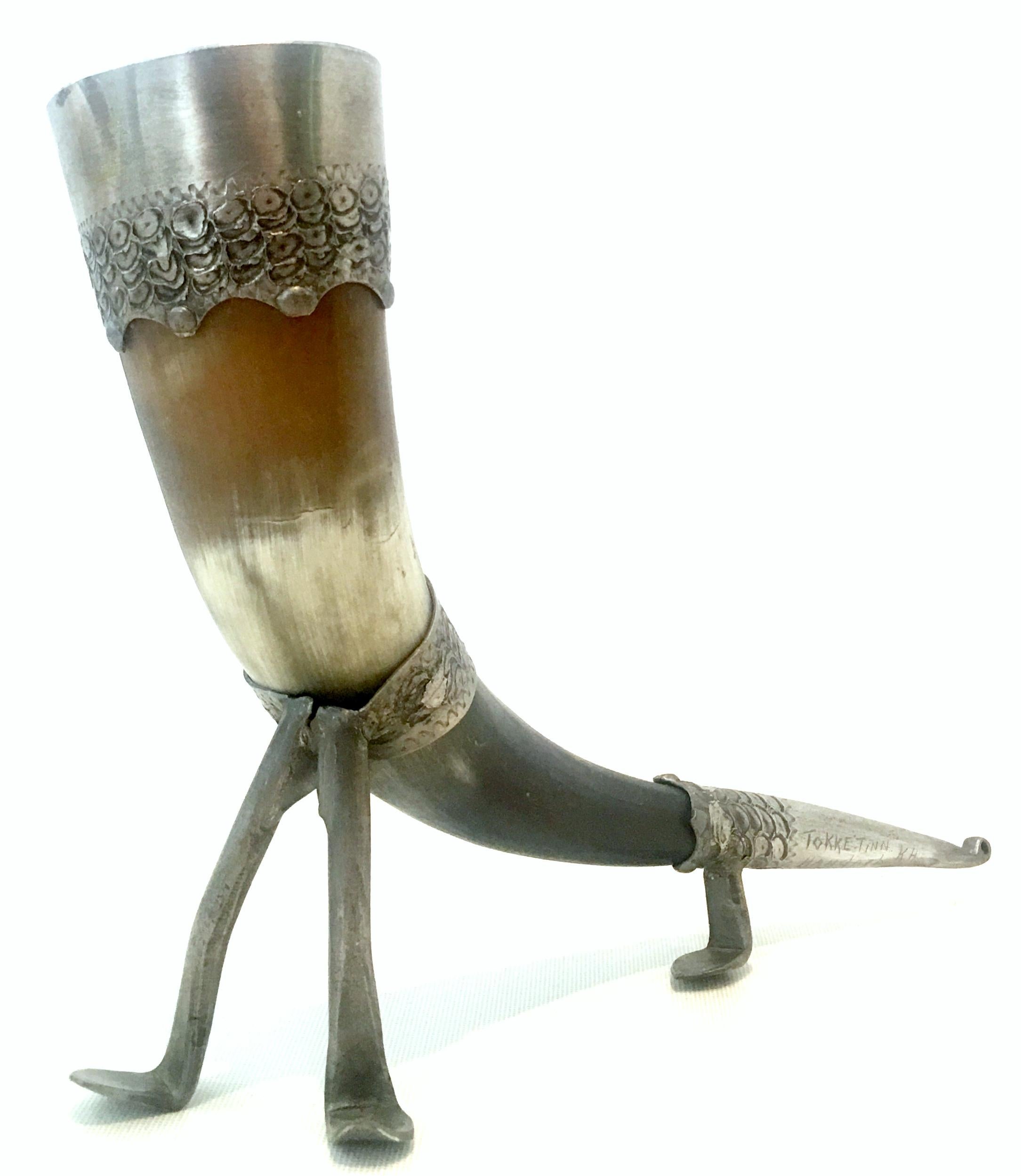 Early 20th century Norwegian horn and engraved pewter footed drinking cup. This handcrafted drinking horn features fitted engraved pewter handwork. Signed, engraved at the 