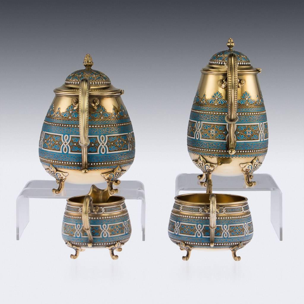 Antique 19th century Norwegian silver-gilt and cloisonneé-enamel tea service, comprised of a hot water pot, teapot, sugar bowl and cream jug, decorated with blue turquoise enamel on wirework floral scrolls, with white intertwining and beaded
