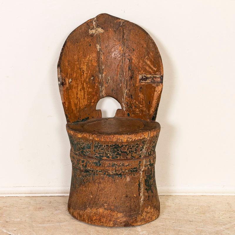 A kubbestol is a traditional Scandinavian chair made from a log. This one is unusual, as it is rare to find one scaled small for a child. Every knot, crack, and sign of wear adds to the intriguing appeal of this hand-hewn stool. Notice in the photos