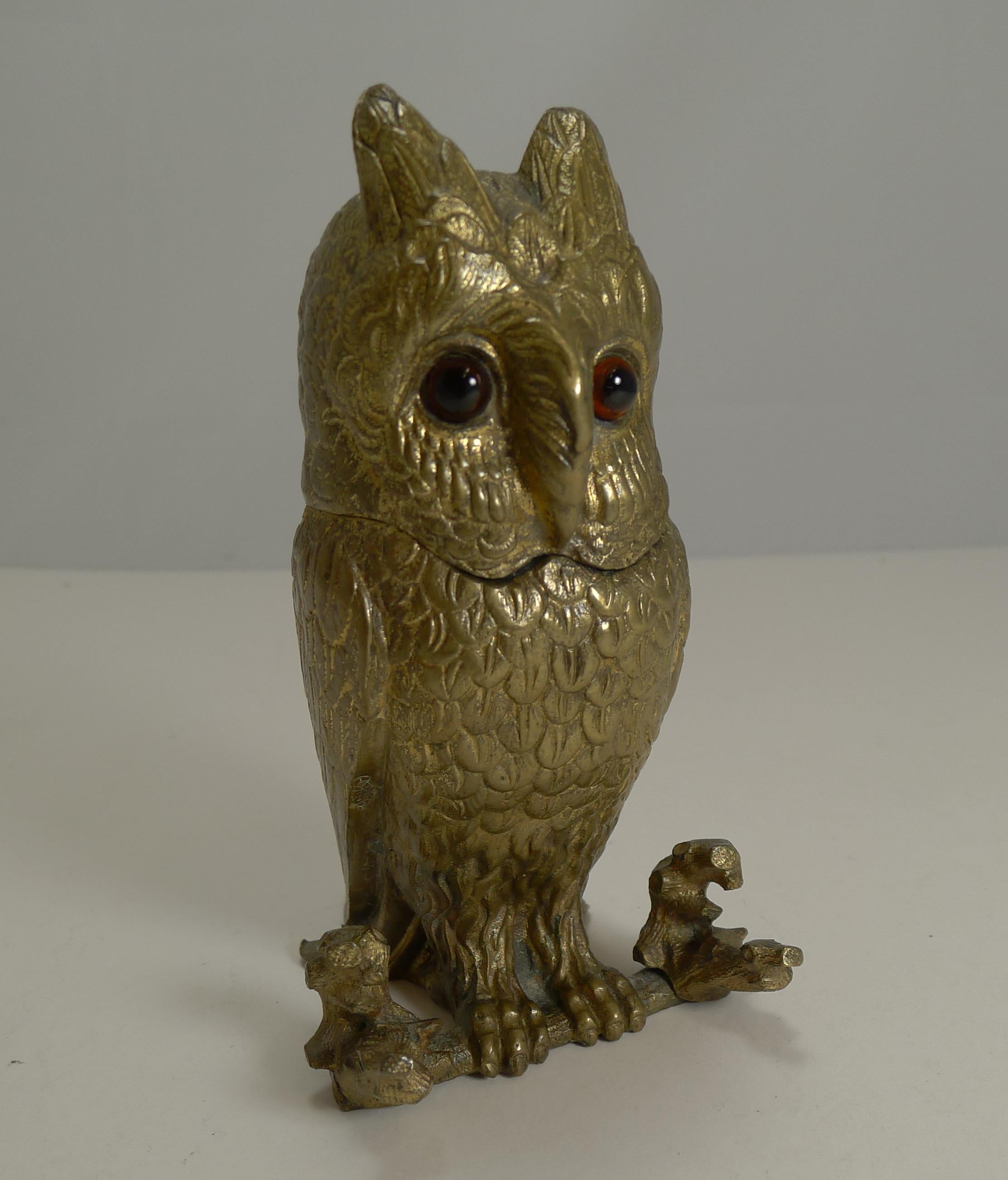 A sensational heavy cast bronze inkwell beautifully cast in the form of an owl, retaining his wonderful original glass eyes, undamaged and a fabulous gilded finish. To the front an integral pen rest as can be seen in the pictures.

The hinged lid