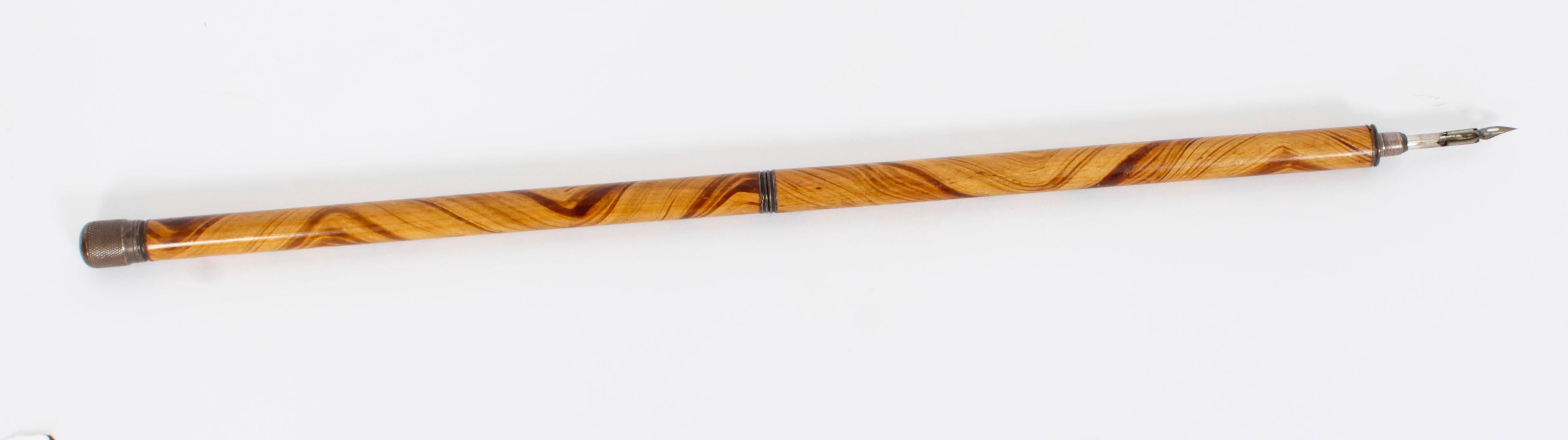 This is a rare and unusual antique French novelty 'pen and pencil' walking cane, circa 1890 in date.
  
The stick with one section unscrewing to reveal a fountain pen, another a propelling pencil and the handle unscrews to reveal an ink well. The