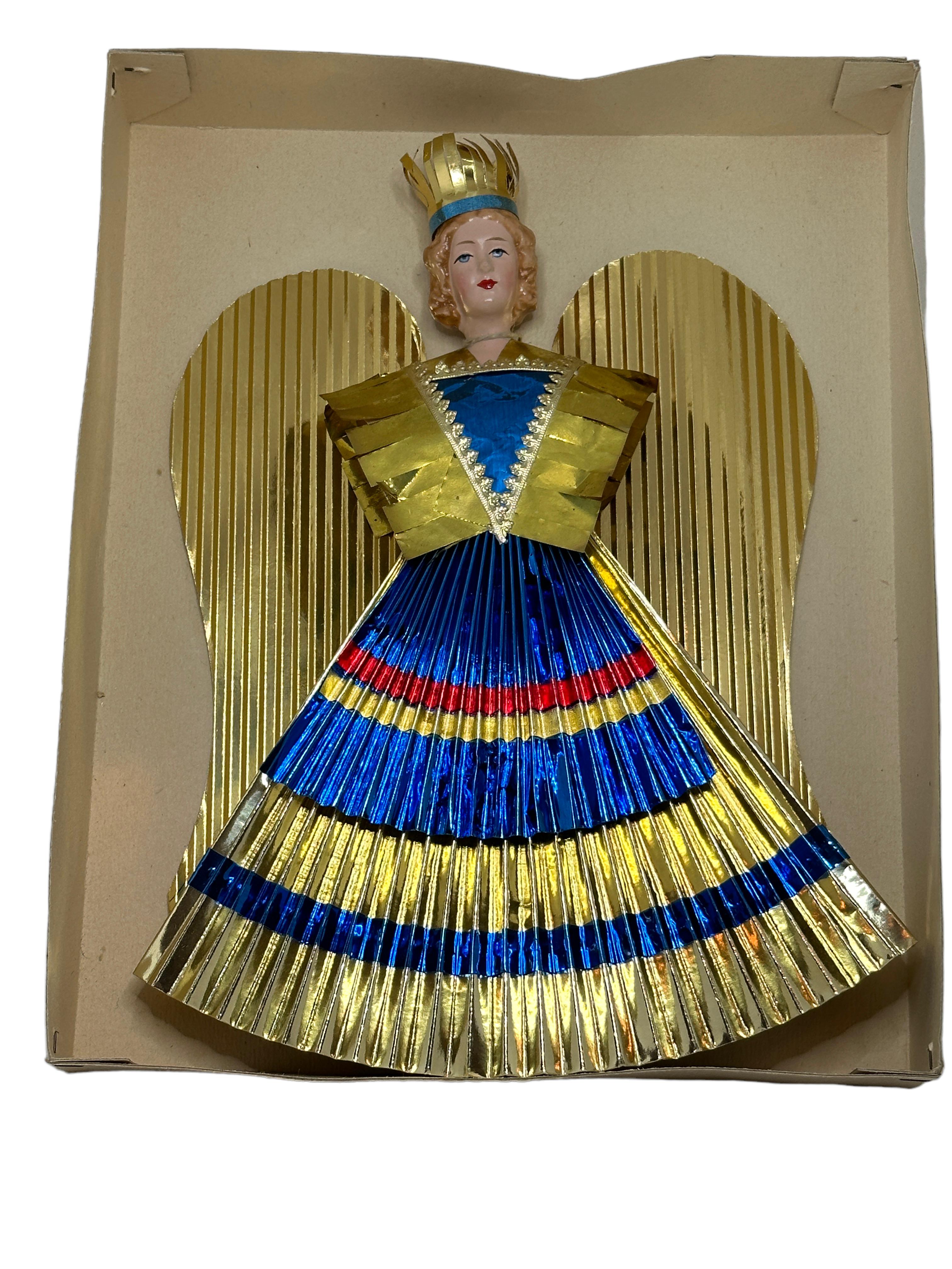 A rare feather tree Christmas tree topper. It is hand made from gold foil, paper and a composition (mass) head, would be a great antique addition for your Christmas or feather tree. 
It is a Nuremberg Christ kindles Market Angel, a traditional Angel