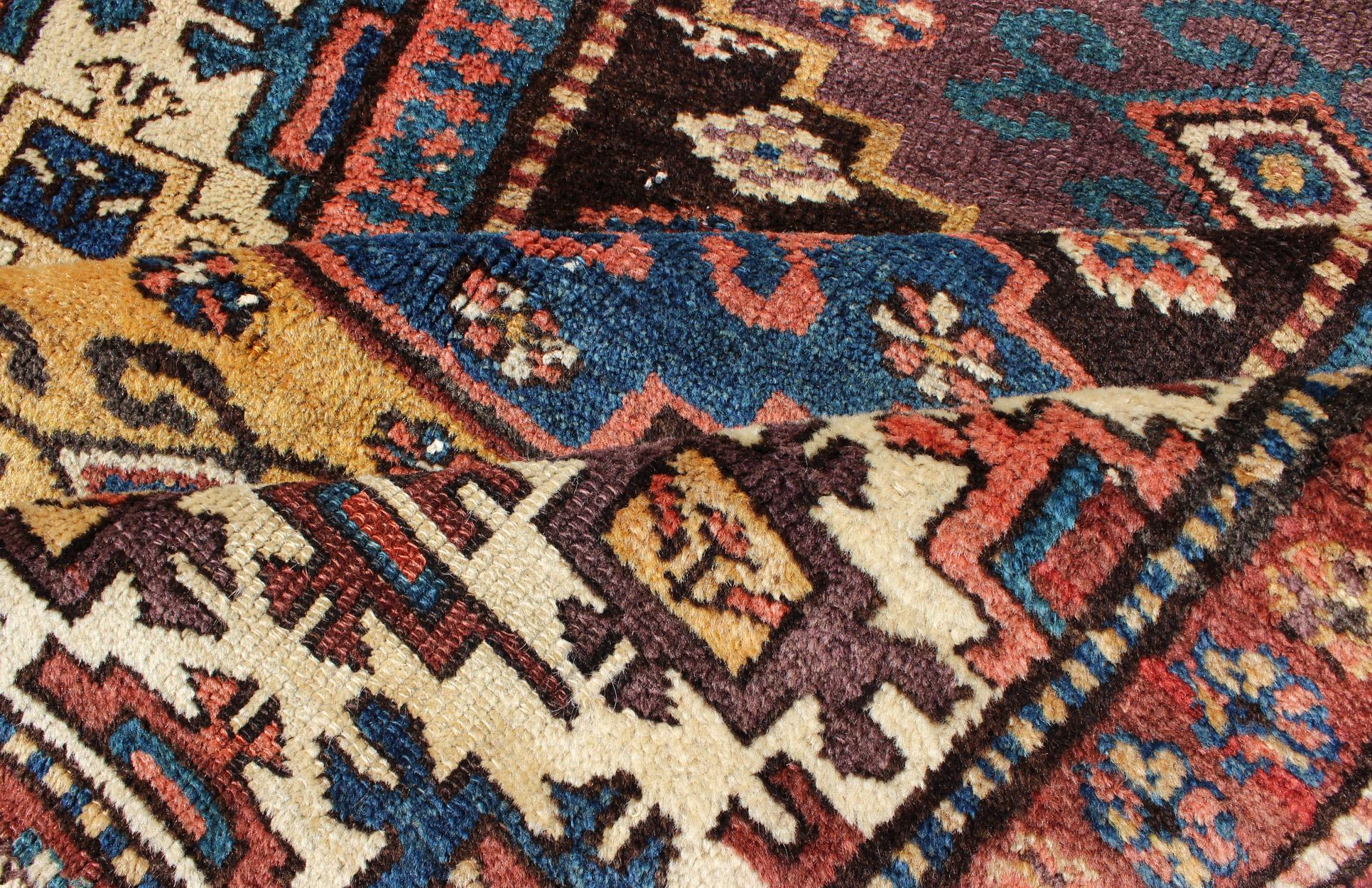Tribal Antique N.W. Persian Gallery Rug in Jewel Tones with Diamond Geometric Motifs For Sale