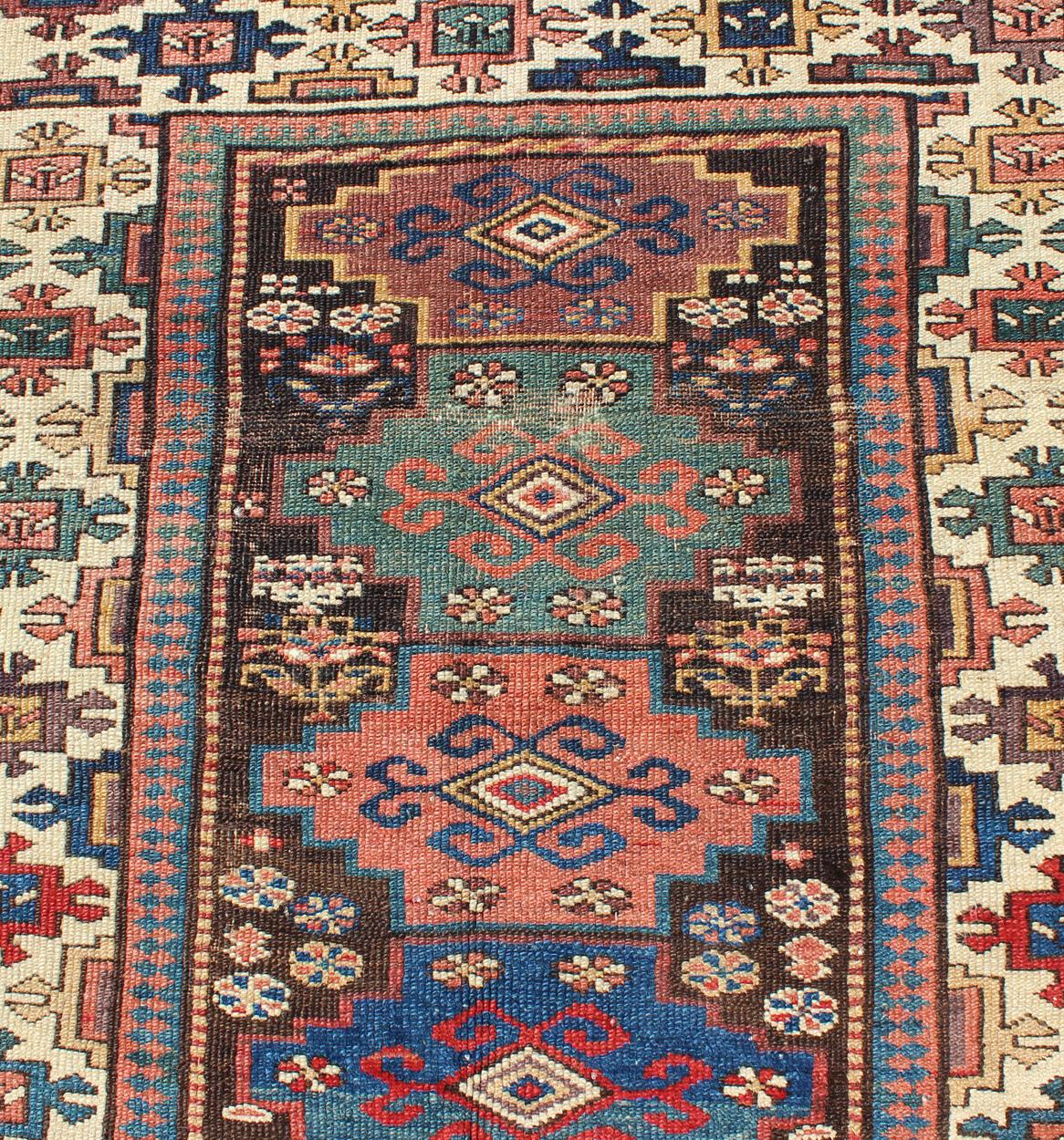 Early 20th Century Antique N.W. Persian Gallery Rug in Jewel Tones with Diamond Geometric Motifs For Sale