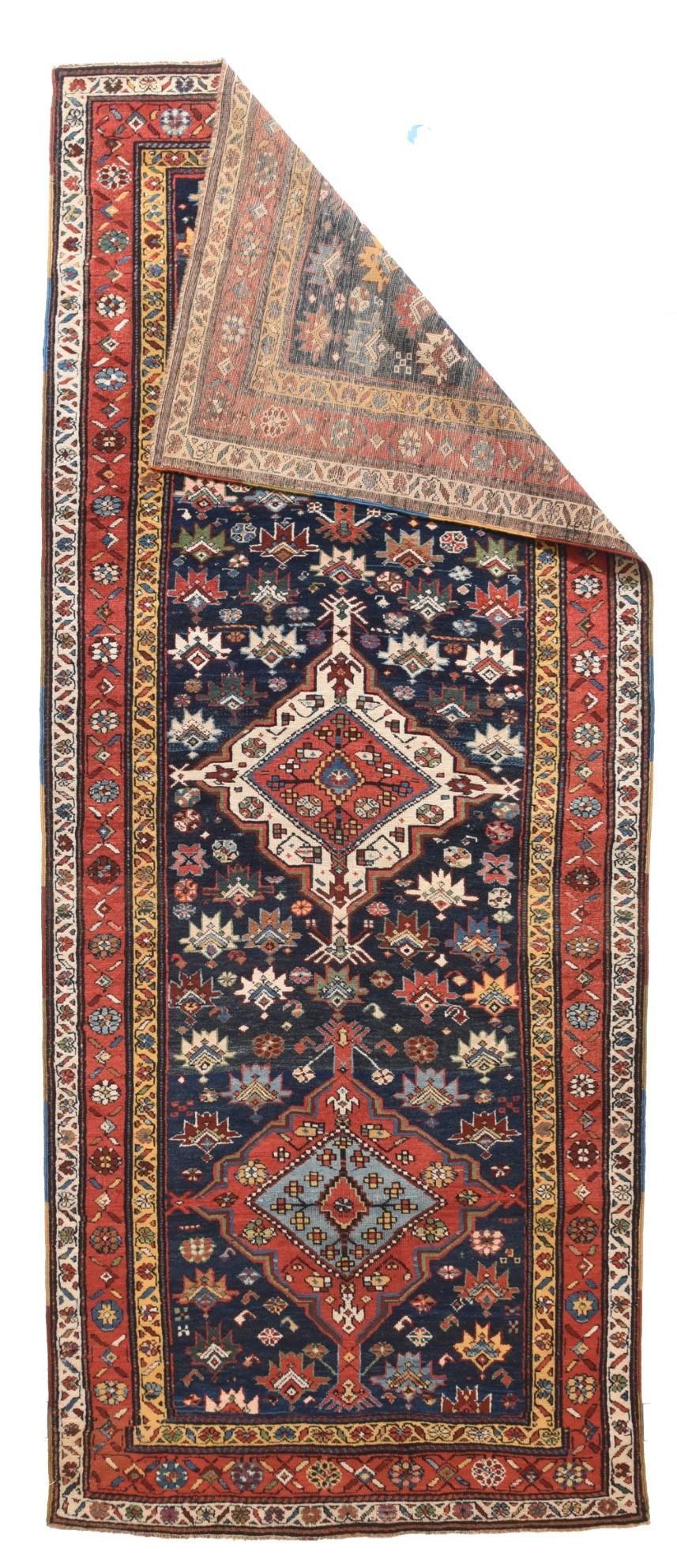 Antique NW Persian Rug 3'9'' x 9'2''. Often Karabagh and Northwest Persian rugs are so close that it is practically impossible to definitively separate them. This wide runner could be either. The dark blue field shows a one-way pattern of sharp