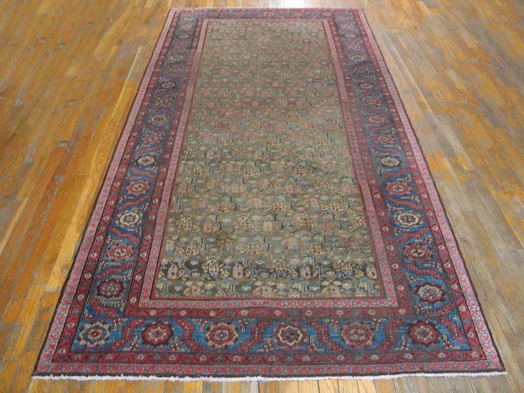 19th Century N.W. Persian Carpet 
Handwoven antique NW Persian carpet. Woven, circa 1890. 
Gallery All-over floral and vine pattern. Camel background with blue border.
( 5' x 10'7
