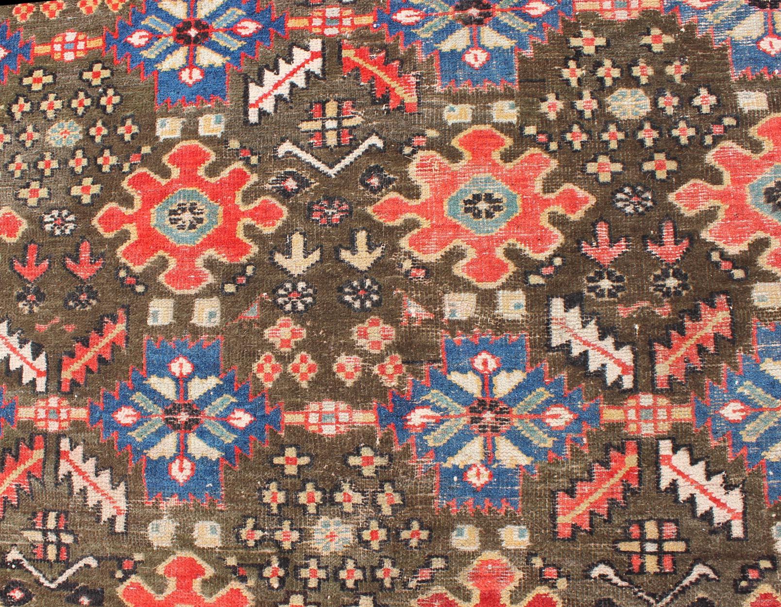 Tribal Large Antique Kurdish Rug with All-Over Design in Brown/Green, Red, and Blue For Sale