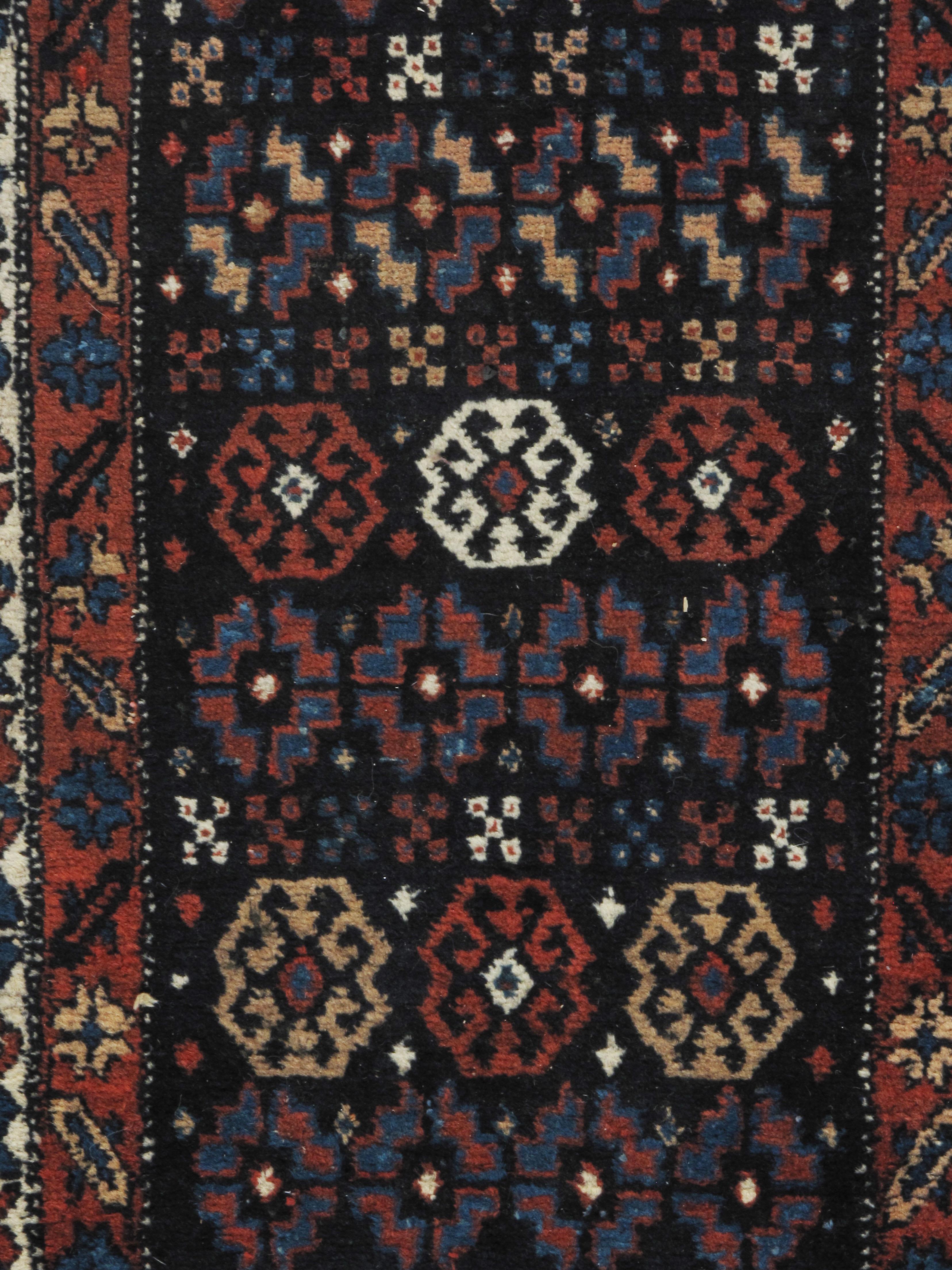 Antique N.W.Persian runner 2'9 X 12'11. From N.W. Persia a lovely antique hand knotted wool runner. Colors navy/multi.