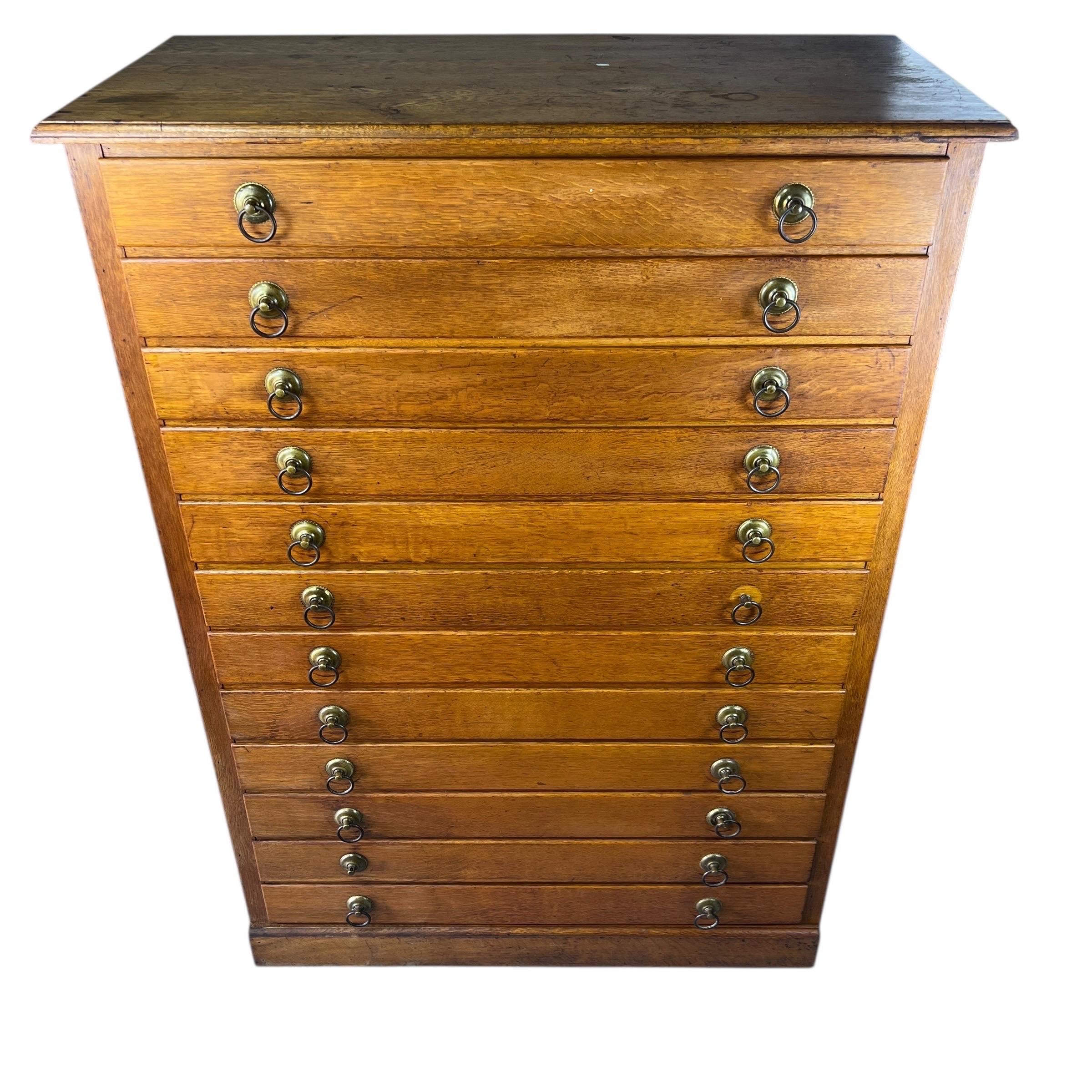 This antique chest of drawers is in overall good condition, showcasing its original, untouched charm. The wood has two medium-sized chips on the front edges and the top has cup marks, along with some discoloration. There are small holes and