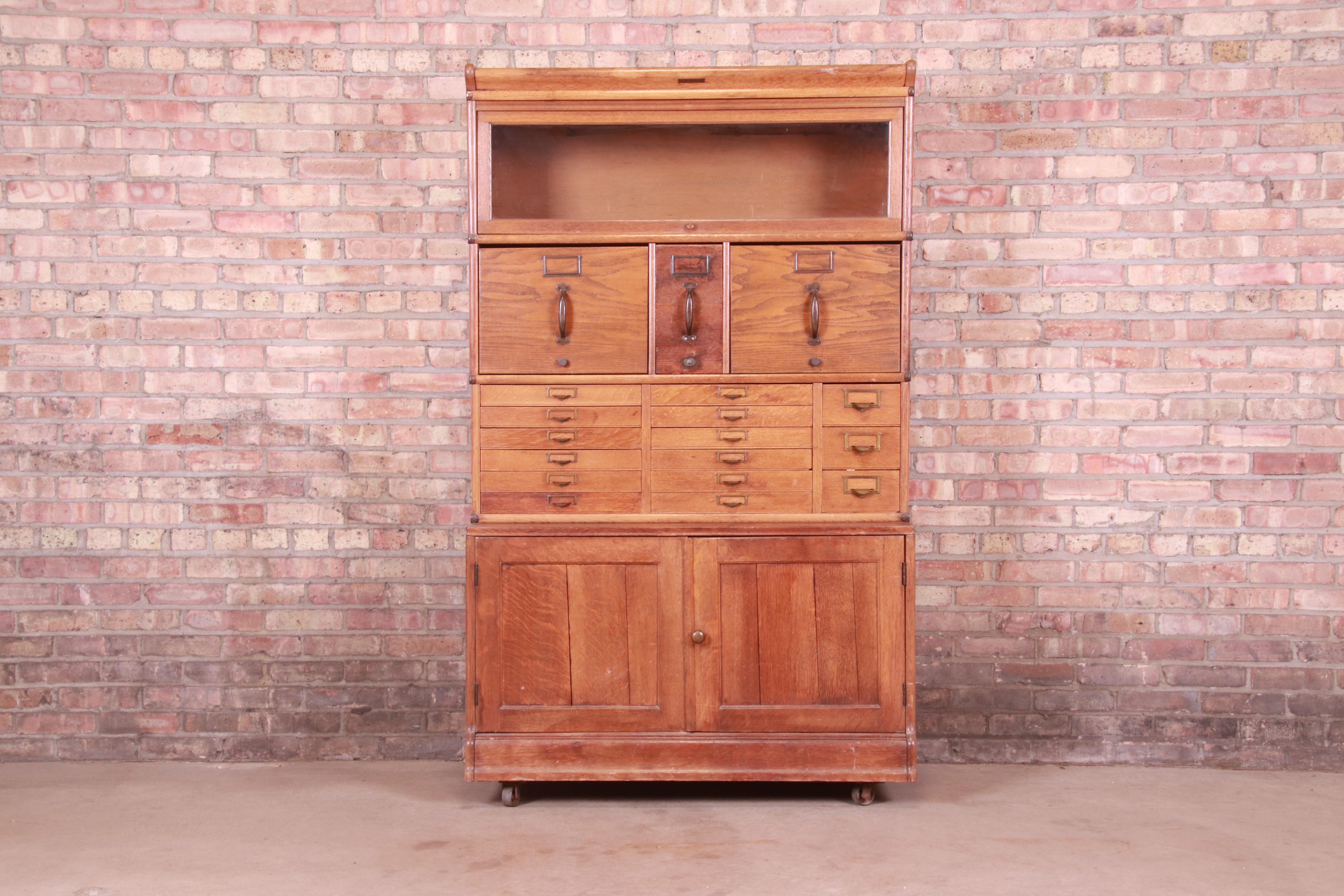 A rare and exceptional antique oak 18-drawer card catalog file cabinet with barrister bookcase

By Fulton Office Furniture Co.

USA, Circa 1920s

Quarter sawn oak, with brass hardware.

Measures: 41.75