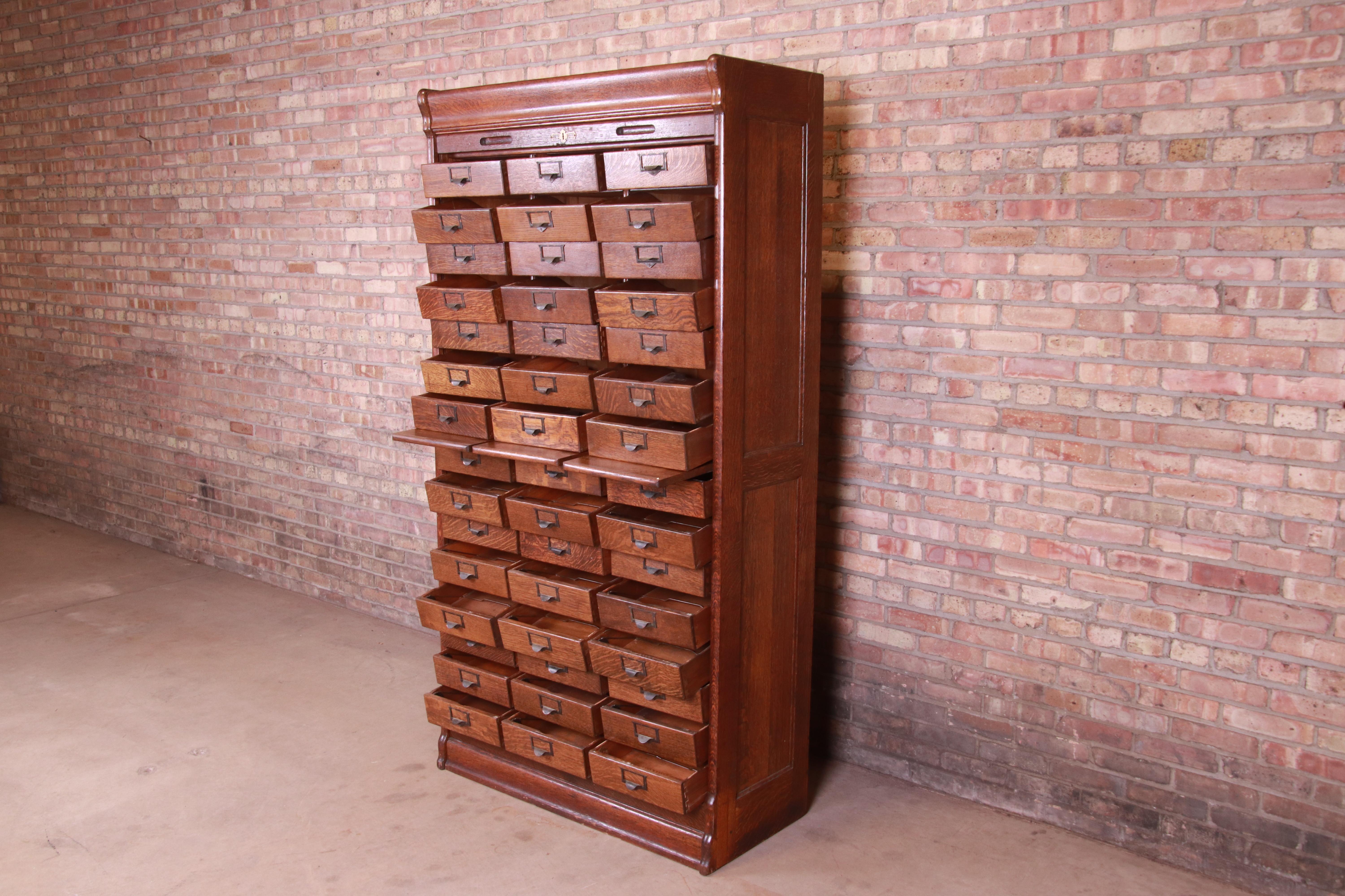 Arts and Crafts Antique Oak 45-Drawer Cabinet with Roll Down Tambour Door, circa 1900