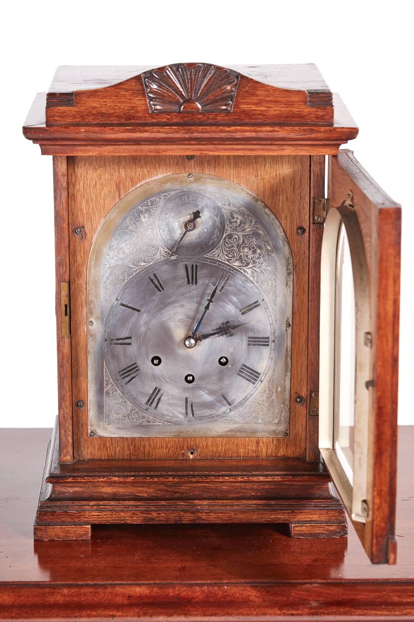 Antique oak 8 day mantel clock, with engraved roman silvered chapter ring with chime / silent dial, 8 day three train movement, carved oak case standing on a shaped base with bracket feet
Working order.