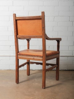 Antique Oak and Leather Armchair with Decorative Carving and Brass Nailhead Trim