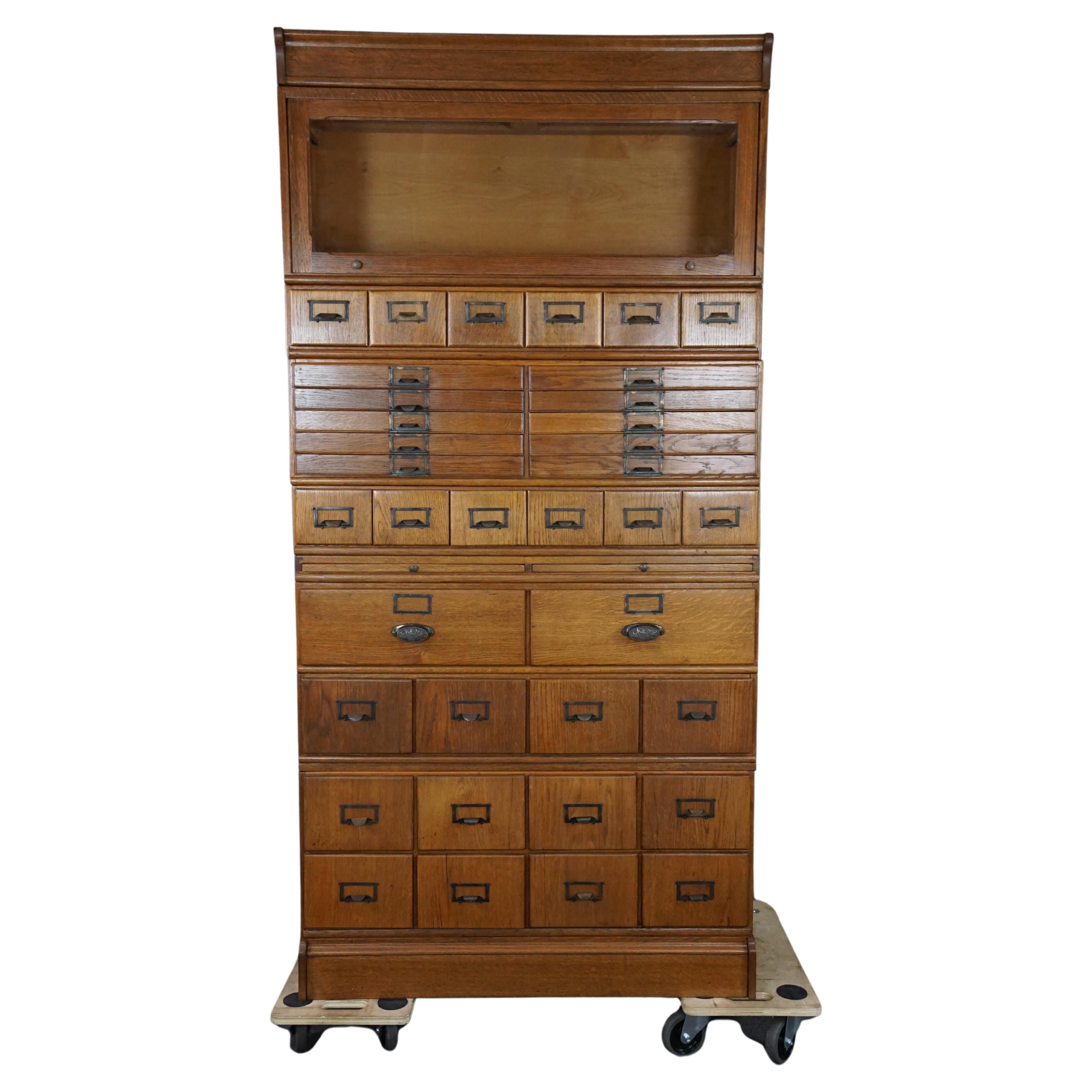 Antique oak apothecary cabinet, early 1900s For Sale