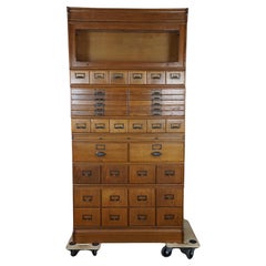 Antique oak apothecary cabinet, early 1900s
