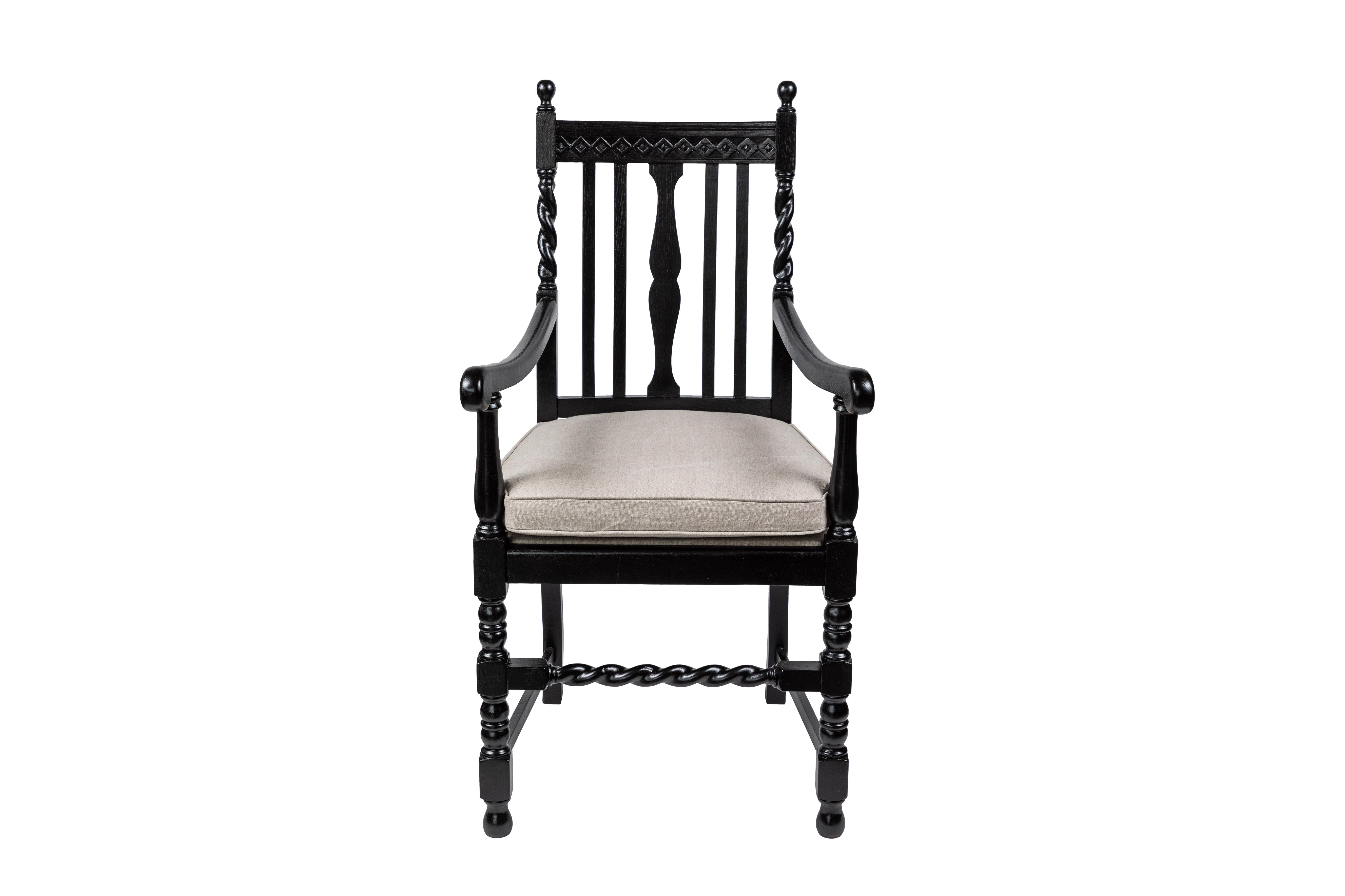 Stately antique oak armchair with slat back and turned wood detailing, has been newly repainted in a gorgeous black lacquer and the seat cushion has been reupholstered in a natural flax linen.

     