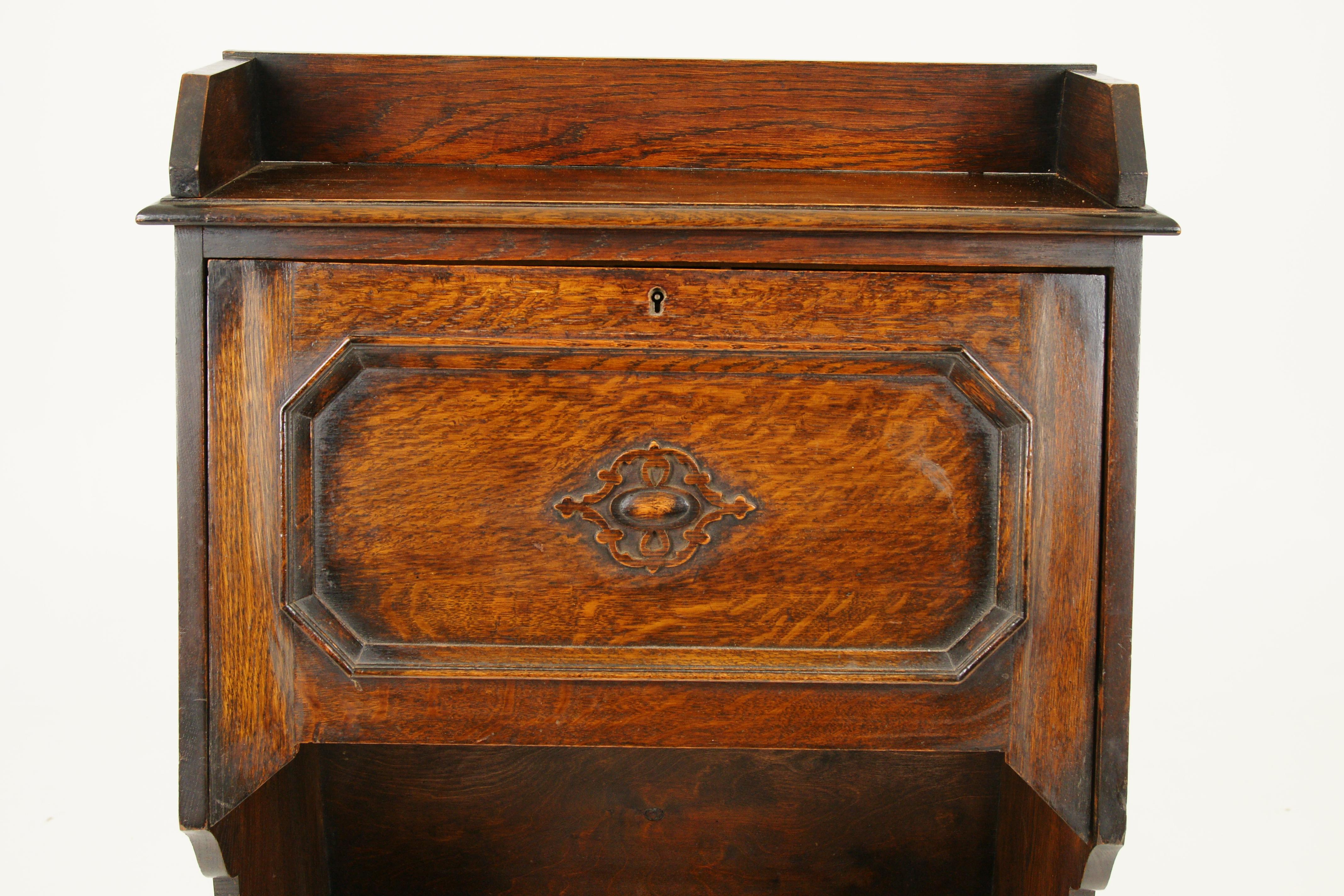 Antique oak Arts & Crafts slant drop front desk bookcase Scotland 1910 B1650

Scotland 1910
Solid oak
Original finish
Shaped gallery top above a fall front paneled front
Opens to reveal a writing surface
Pigeon holes inside with pen