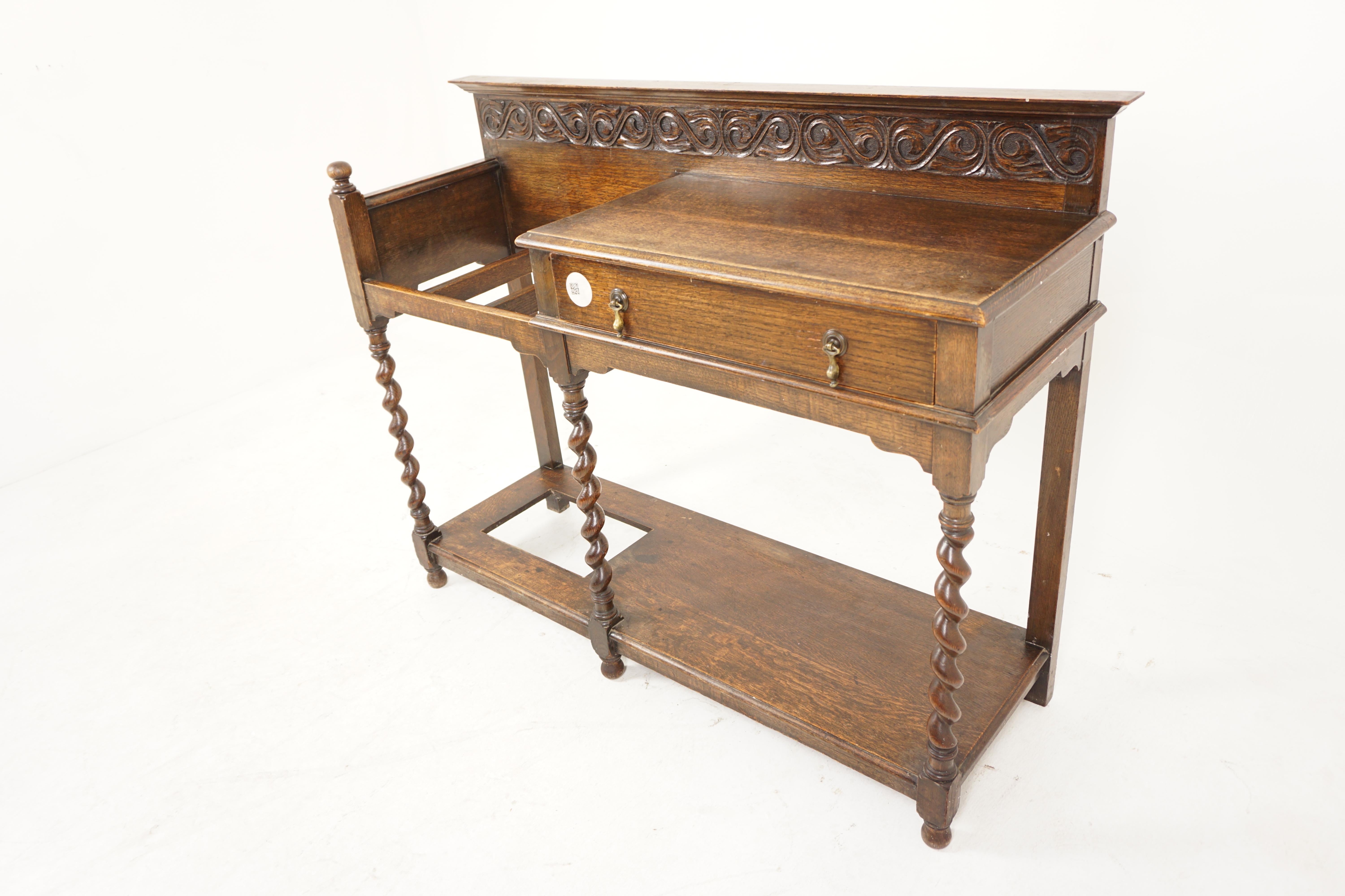 Antique Oak Barley Twist Carved Stick Stand, Scotland 1900, H1022

Scotland 1900
Solid Oak
Original Finish
Carved Pediment on top
Rectangular shelf below with a single drawers and original brass hardware
To the left is an open stick stand