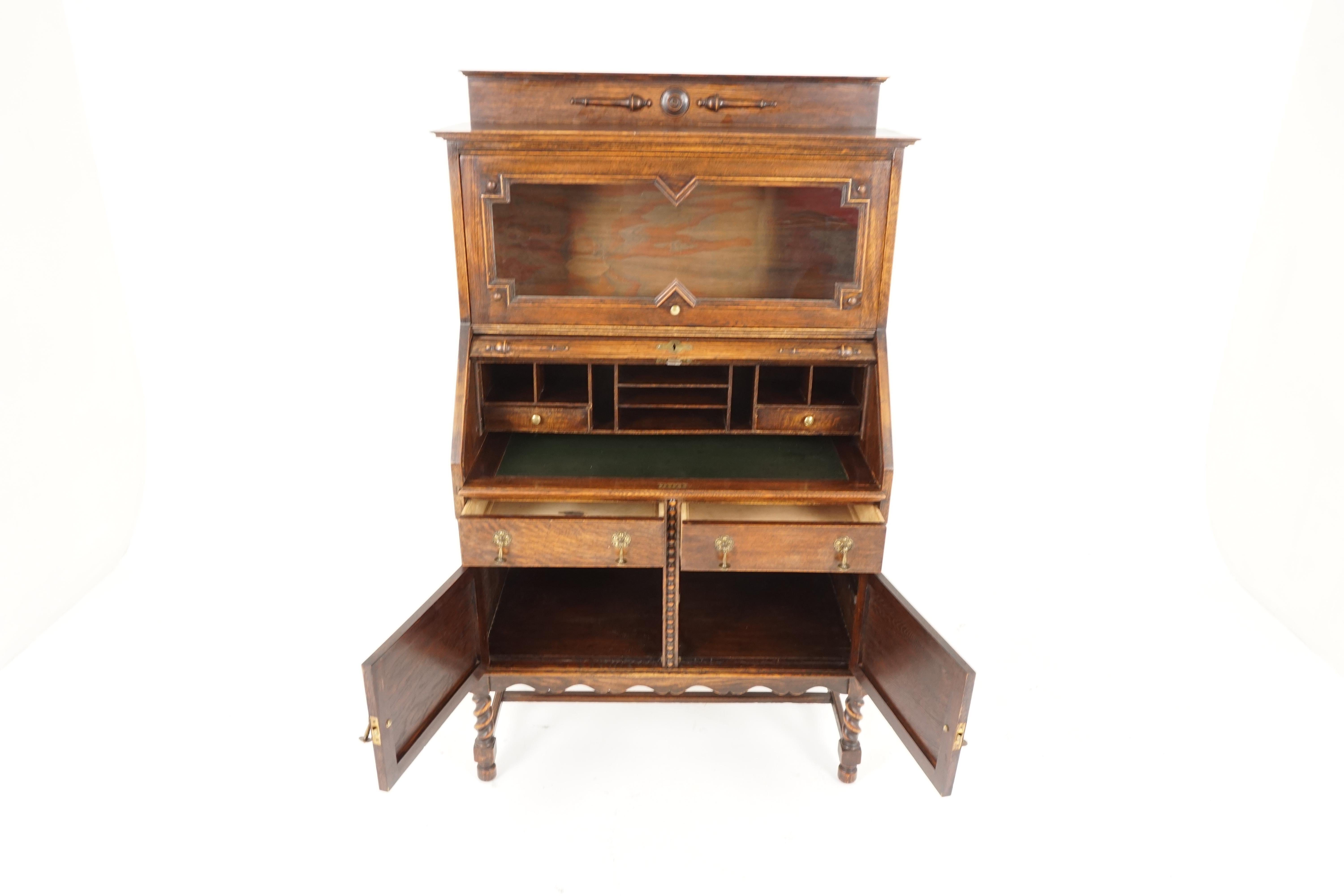 Antique oak barley twist roll top desk shutter front desk, Scotland 1910, B2197

Scotland 1910
Solid oak
Original finish
Raised gallery back
Bookcase below with up and over glass door
Roll top desk with lock and key
Pull out leather top