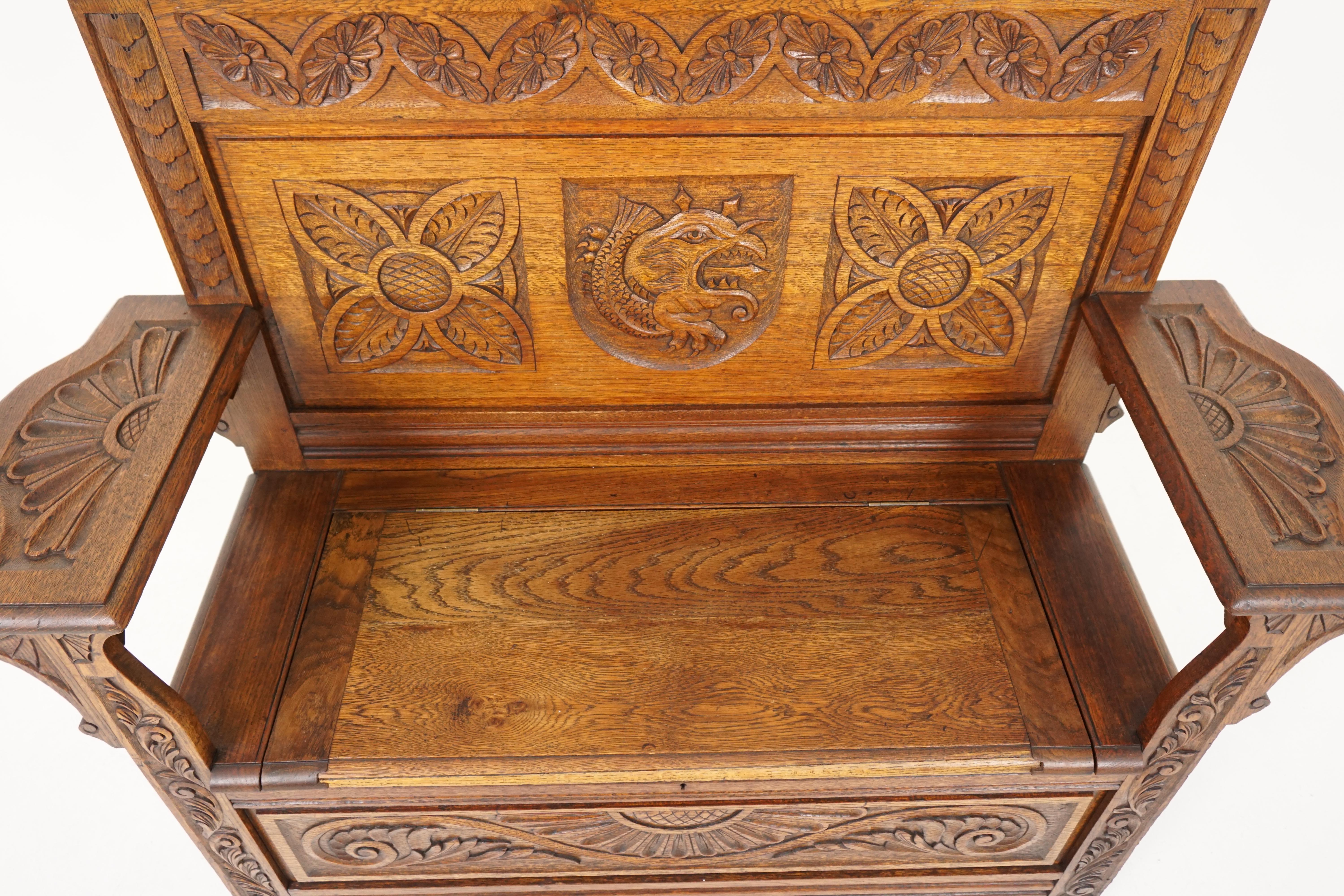 Antique carved bench, Victorian heavily carved oak green man hall bench, antique furniture, Scotland, 1880, B1829

Scotland, 1880
Solid oak
Original finish
Carved pediment top
Carved back panel with central carved sea serpent
Flanked by a