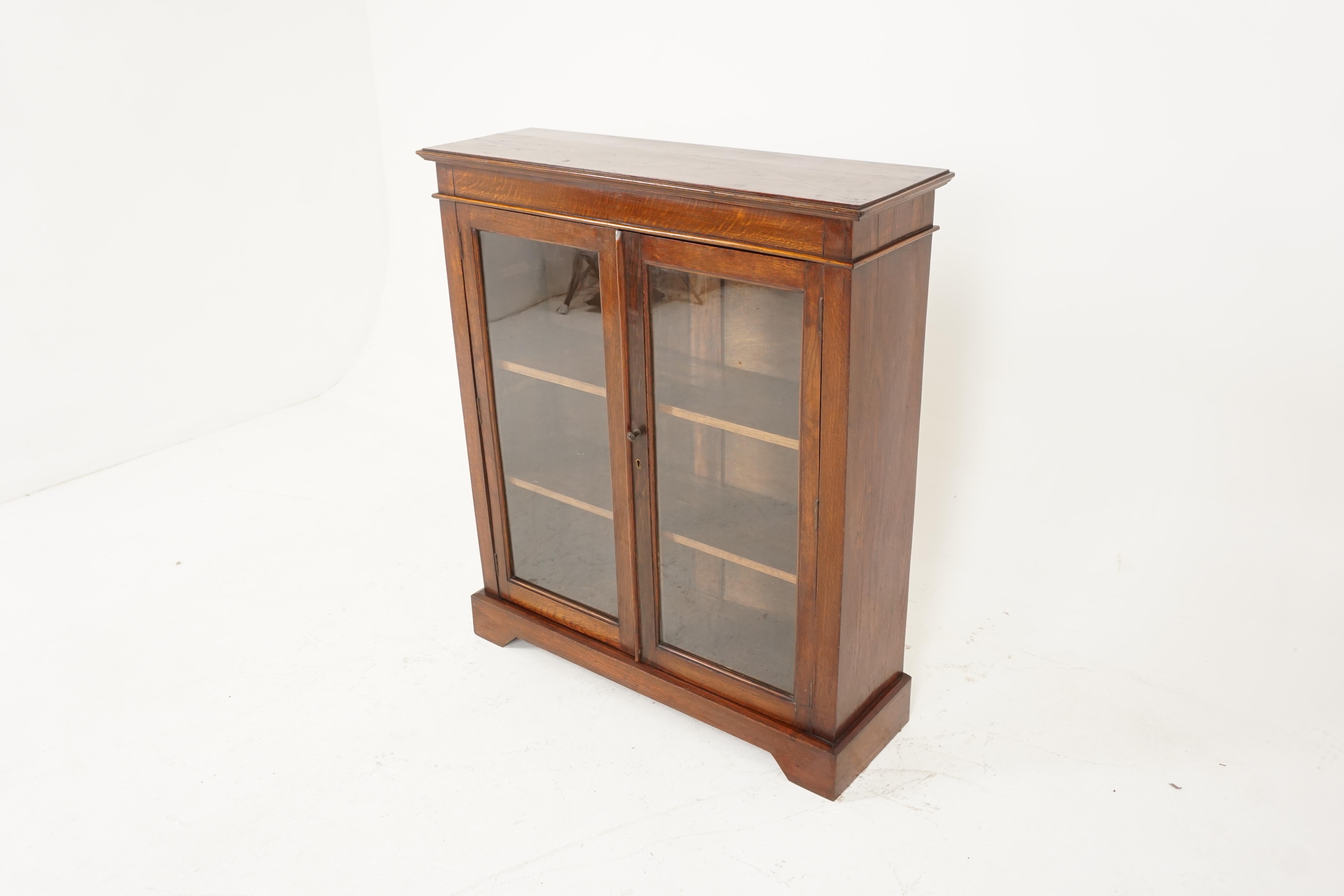 Antique oak bookcase, two door display cabinet, Scotland 1920, B2360

Scotland 1920
Solid oak
Original finish
Rectangular top with moulded cornice
Pair of original glass doors
Inside a pair of adjustable shelves
Standing on a plinth