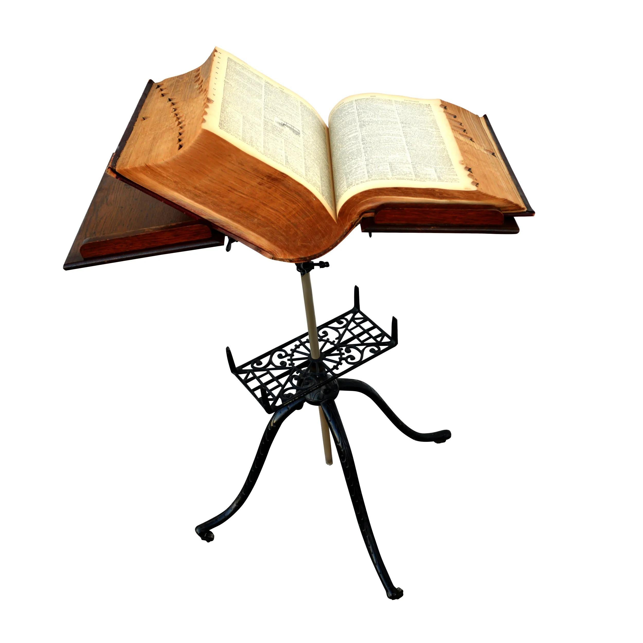 Antique oak cast-iron lectern or folio stand

Antique Arts & Crafts library or parlor book Stand traditionally used to display bibles. Featuring ornate wrought iron pedestal base and quartersawn oak book holder. Cast iron base with cabriole legs.