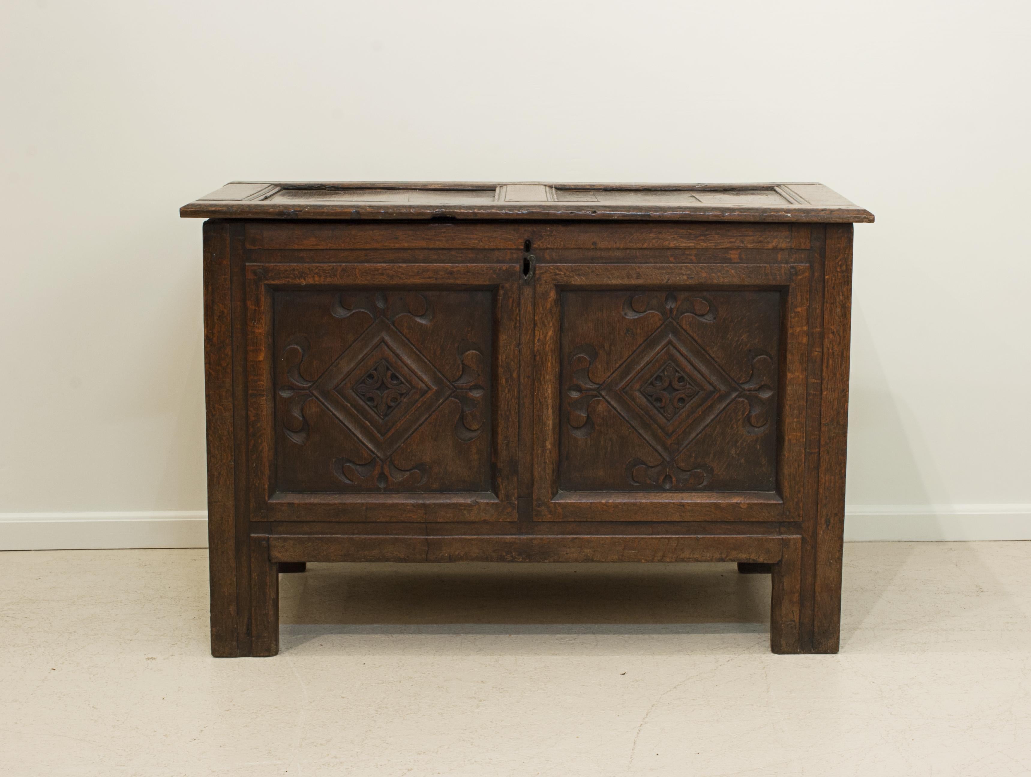 Antique Oak Coffer.
A lovely small proportioned oak antique coffer or chest from the 18th century. The chest with a carved two panel front and made with peg-joined construction. It has a two-paneled top with lock, no key, and iron hinges. A great