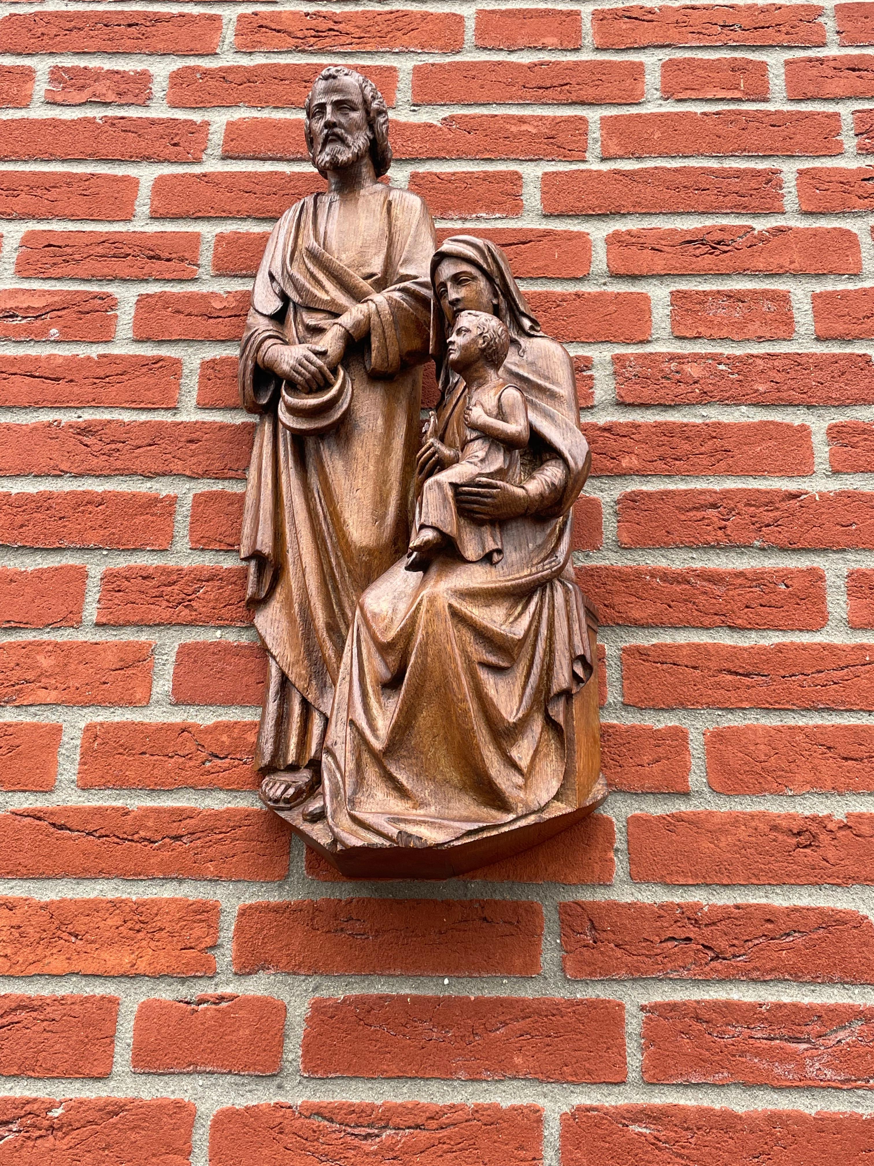Symbolic and meaningful work of religious art.

What we love most about this unique and entirely handcarved church sculpture is the serenity that it radiates. Joseph and Mary are as calm and serene as can be and the Child Jesus is looking at the sky