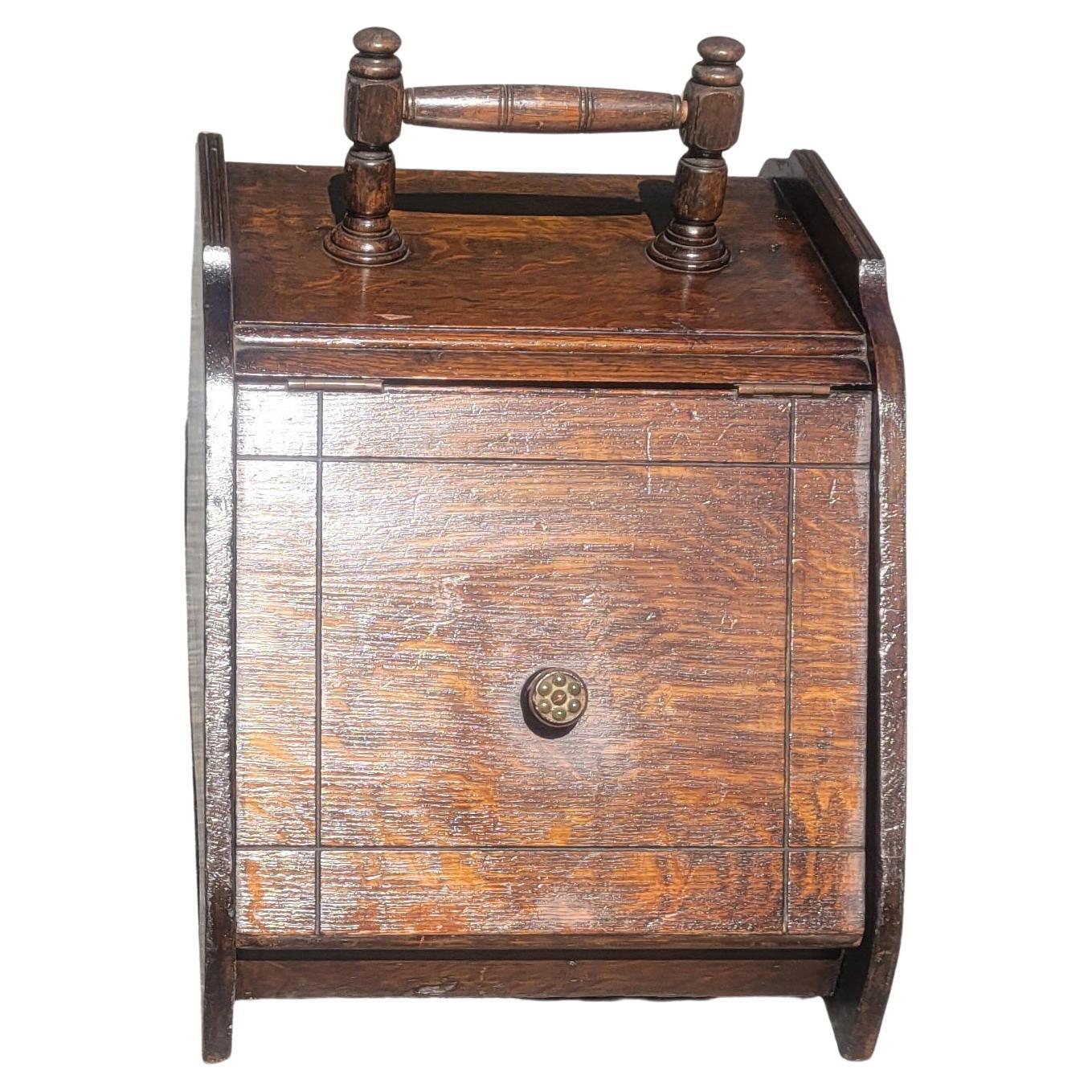 1890s antique coal scuttle box. Handcrafted oak wood. Metal line interior. Great addition to your fire place décor
Measures 13.5