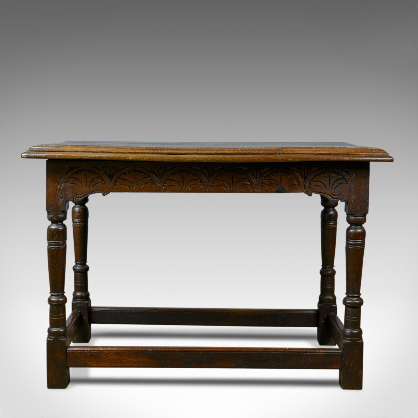 This is an antique oak console table. An English, Jacobean revival refectory table dating to the 18th century and later. 

Substantial English oak with good grain detail 
Planked top in a very robust 4.5cm (1.75