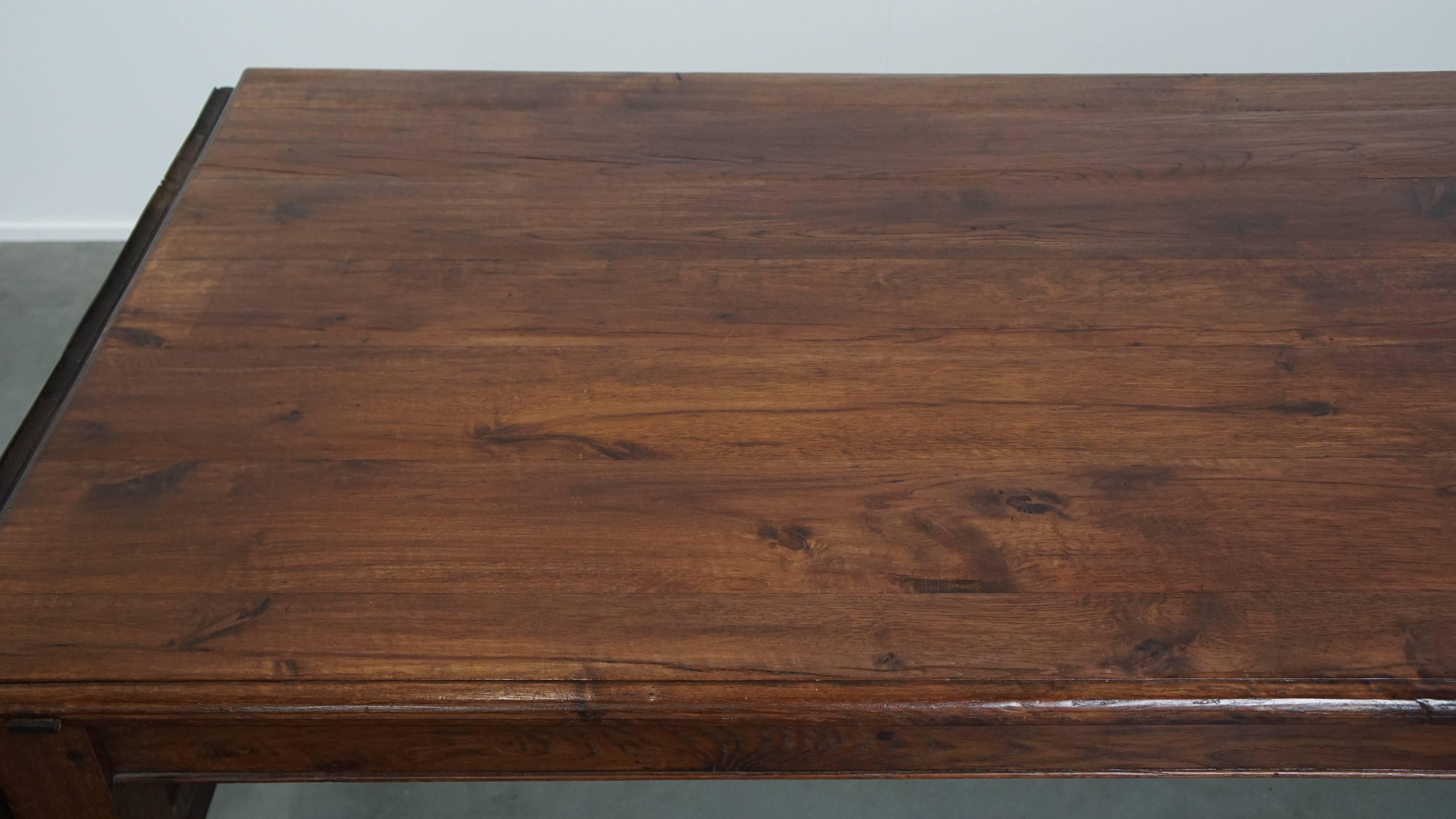 Antique oak dining table from early 1900 with a drop-leaf on one side For Sale 4
