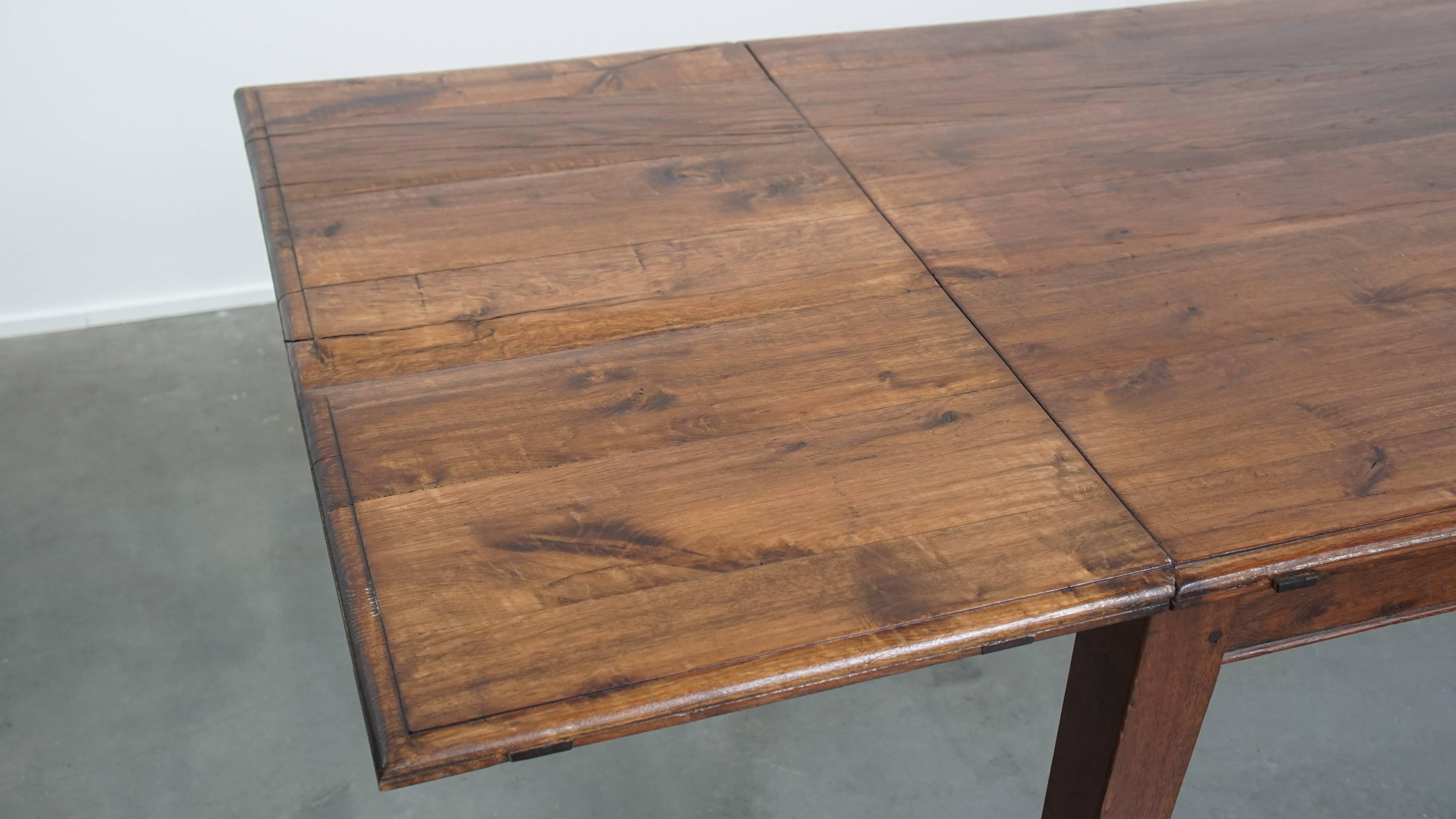 Antique oak dining table from early 1900 with a drop-leaf on one side For Sale 6