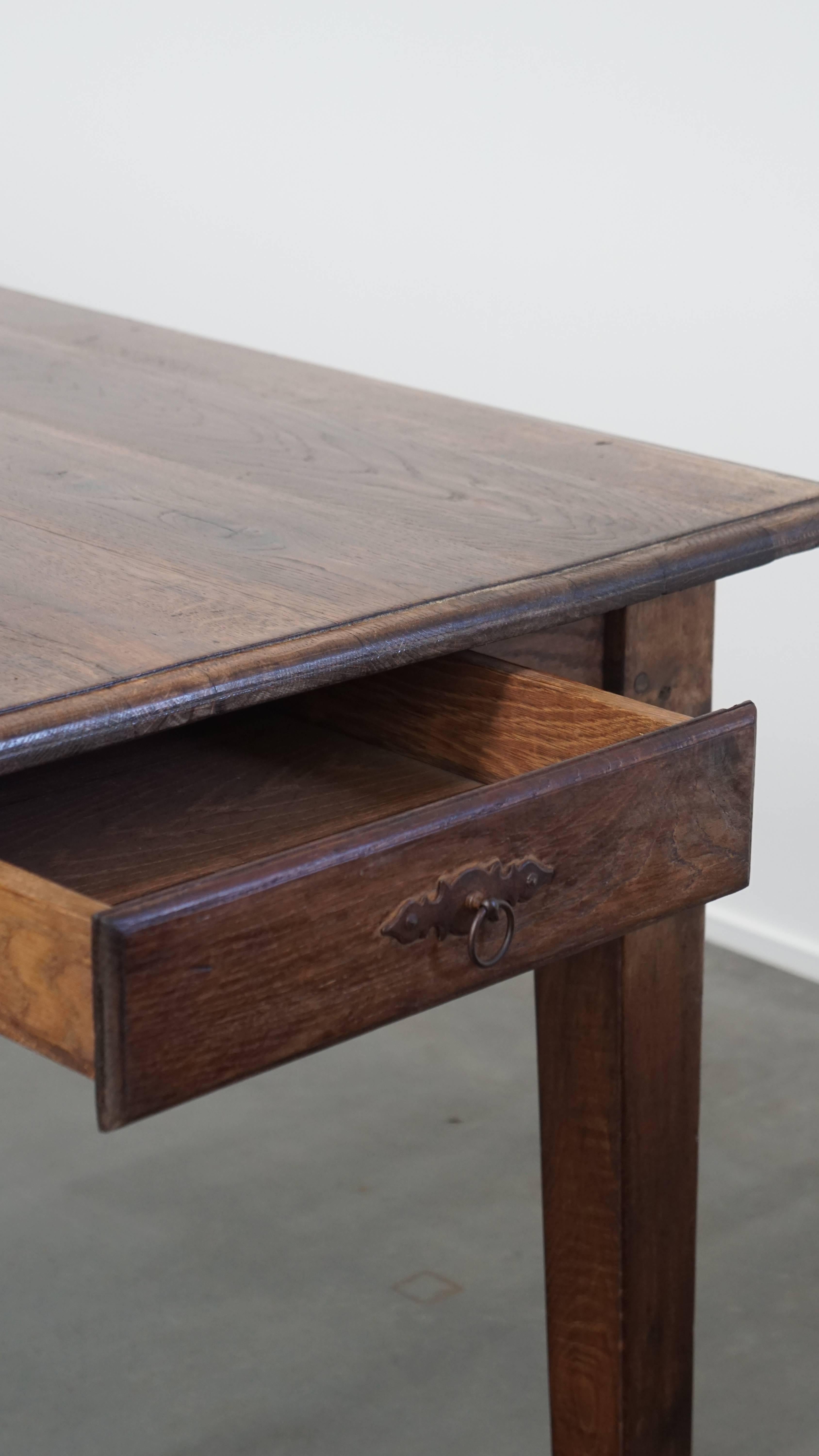 Antique oak dining table from early 1900 with a drop-leaf on one side For Sale 10