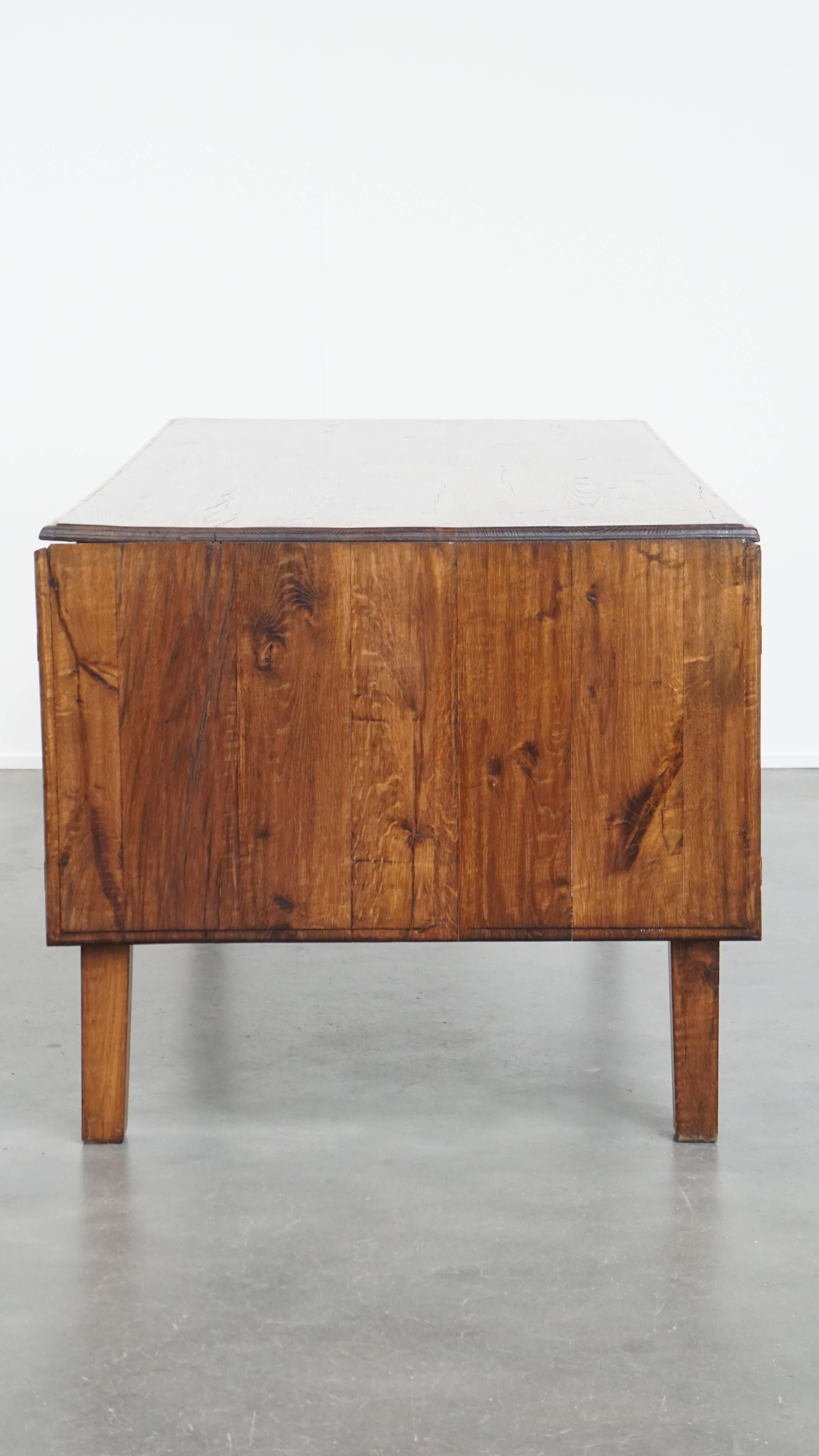 Antique oak dining table from early 1900 with a drop-leaf on one side In Good Condition For Sale In Harderwijk, NL