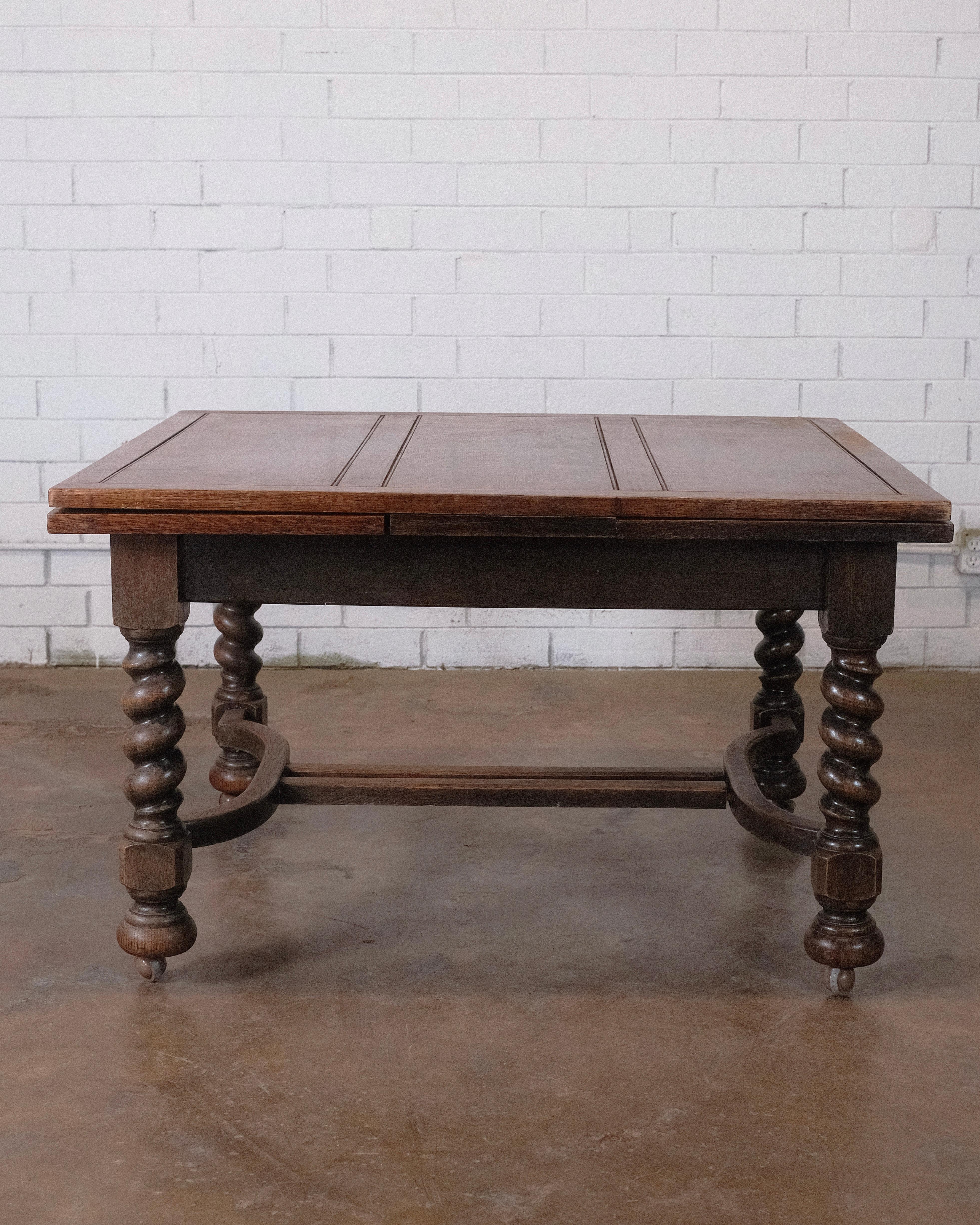 Timeless Antique Oak Draw Leaf Dining Table: Expandable design, rich patina, and enduring oak craftsmanship. The draw leaf mechanism allows for expansion, accommodating both intimate gatherings and larger occasions. Versatile and elegant for any