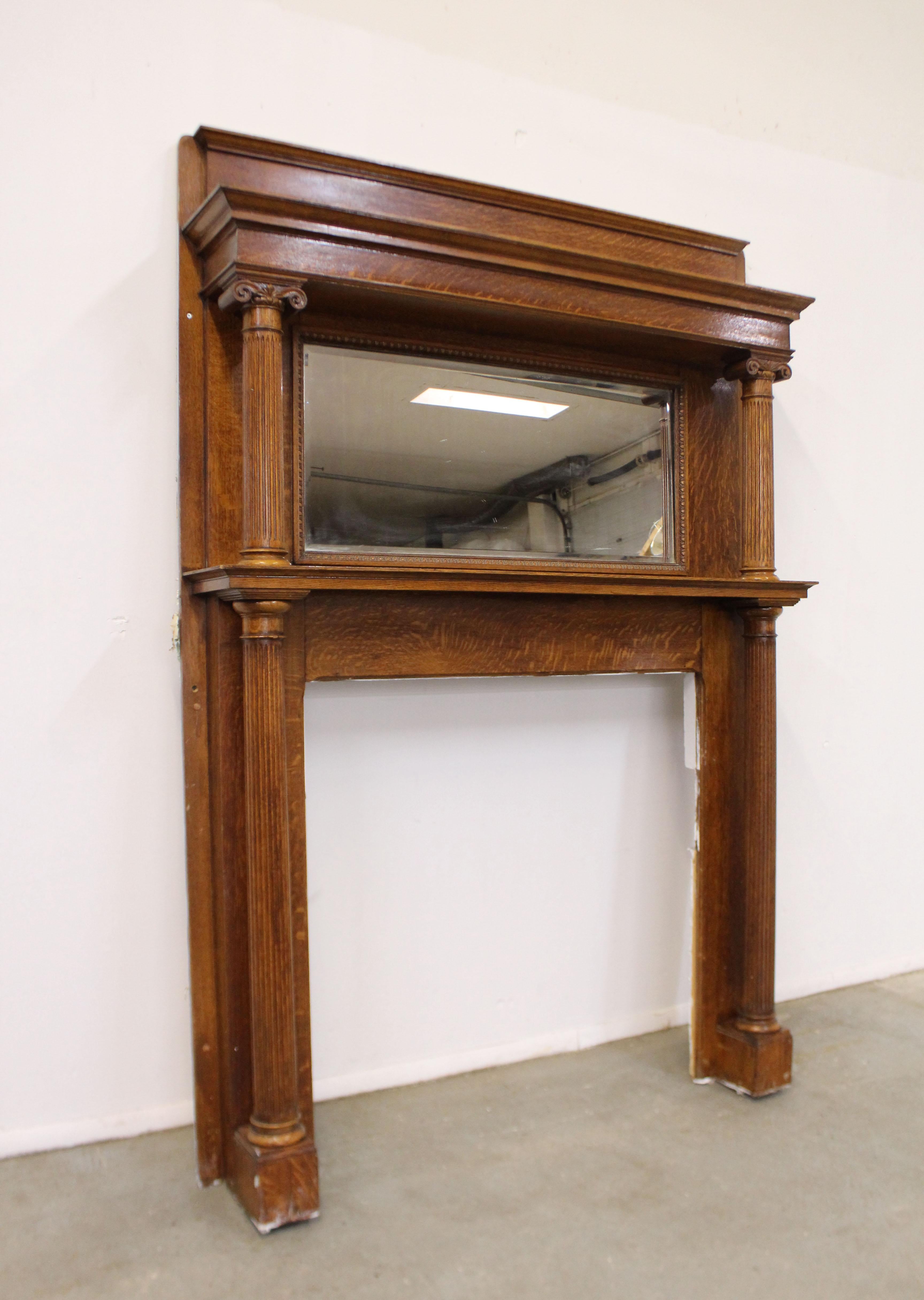 Offered is a beautiful antique solid oak fireplace mantel, circa 1890-1910 - unsure of the exact age. Features beautifully carved accents and a mirror. It is in excellent condition considering its age. Has minor surface wear on the mirror, minor