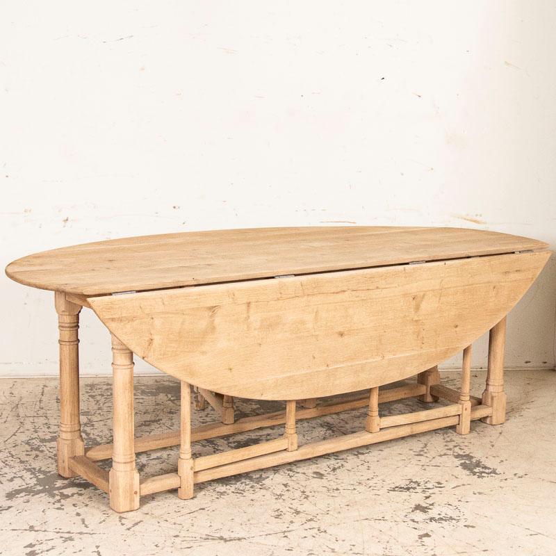 Beauty and function combine in this attractive oak gateleg table also known as a wake table. Easily seating 8-10 guests, the gate legs allow chairs to comfortably encircle the table. The oak has been sanded yet left unfinished, allowing the buyer to