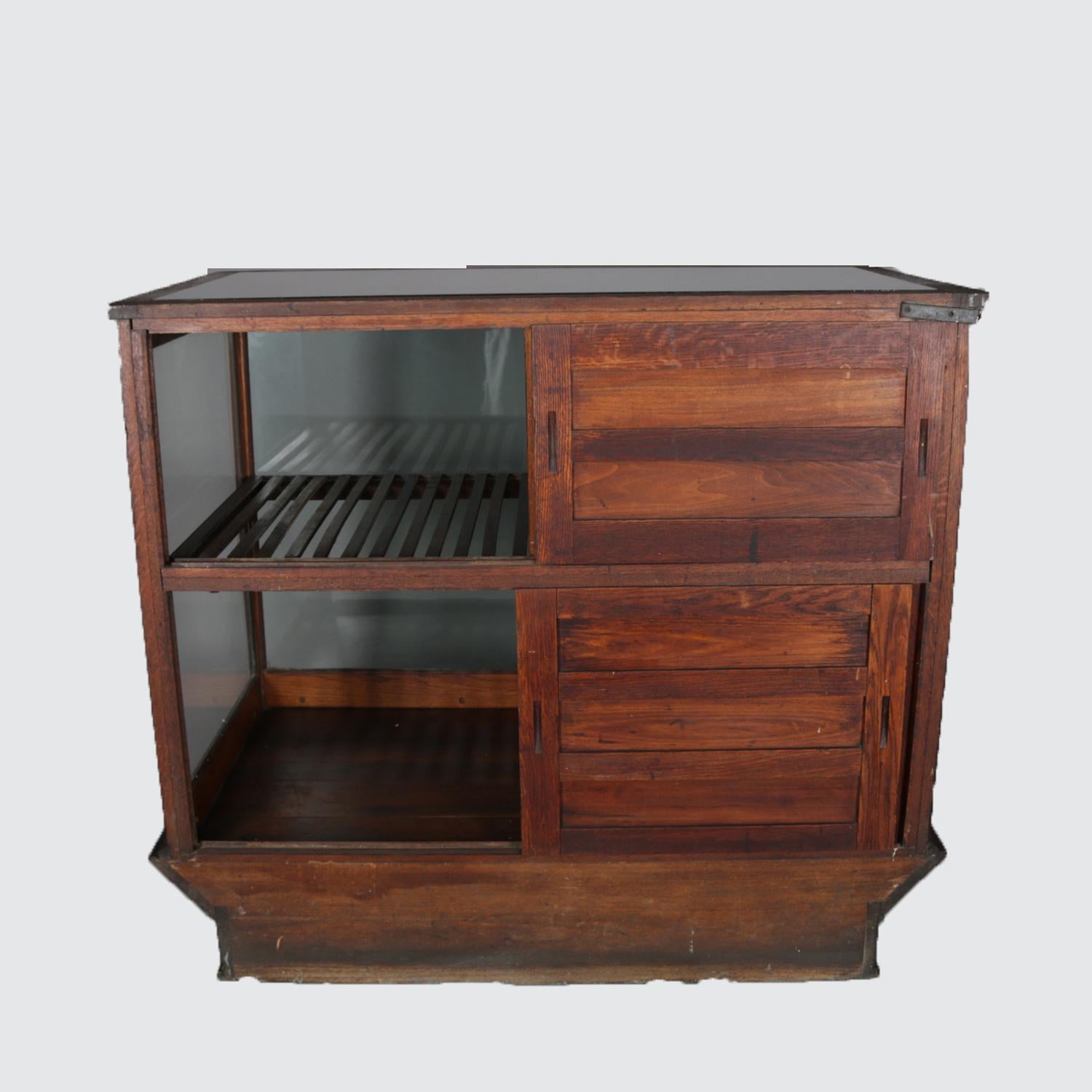 American Antique Oak and Glass Country Store Display Cabinet by Sun Mfg. Co., circa 1900