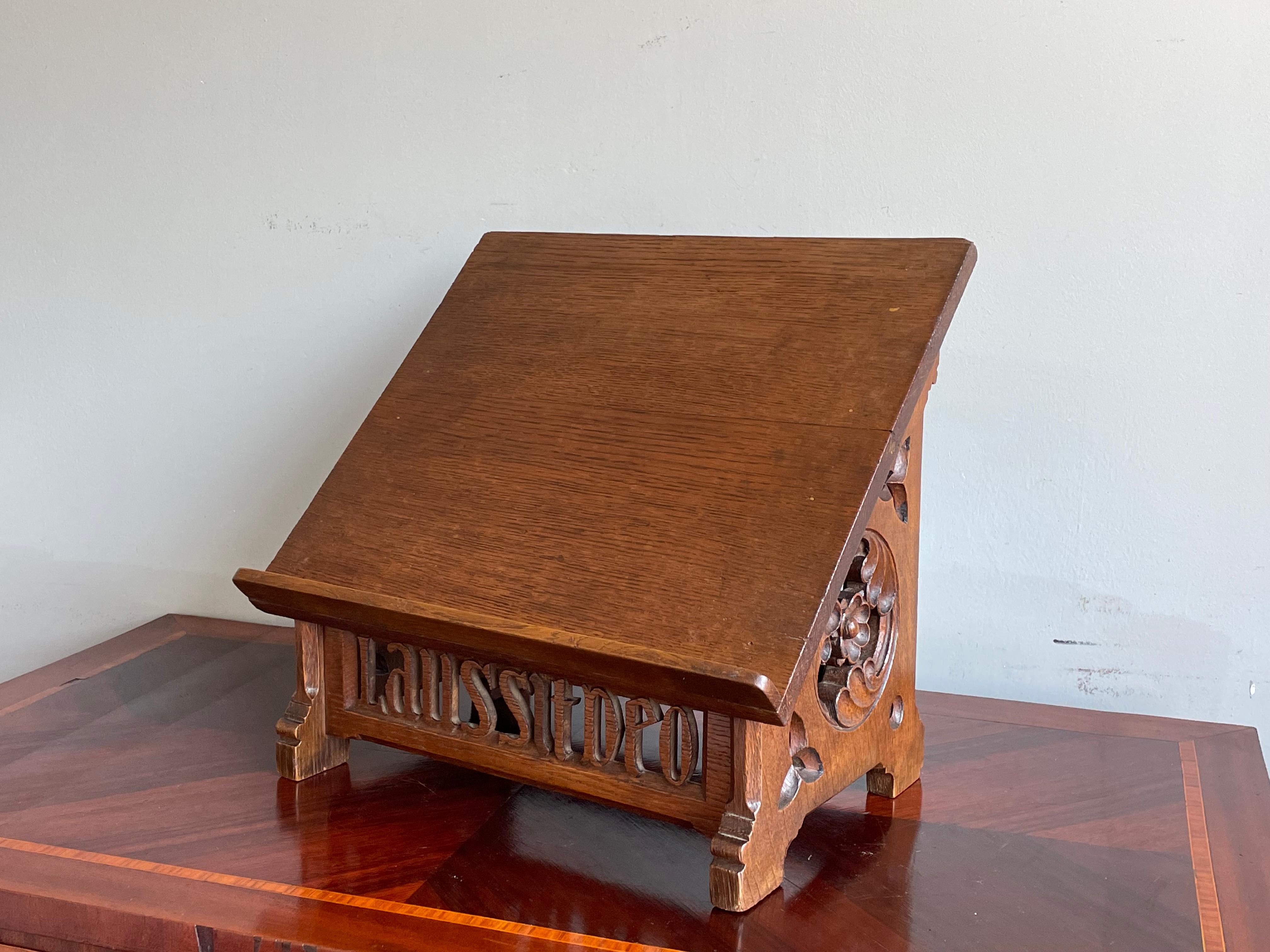 Unique church or monastery bible stand with perfectly hand carved Laus Sit Deo text.

This beautifully hand carved Gothic bible stand dates from circa 1890-1900 and it is entirely made of solid oak. This unique church bible stand is in very good