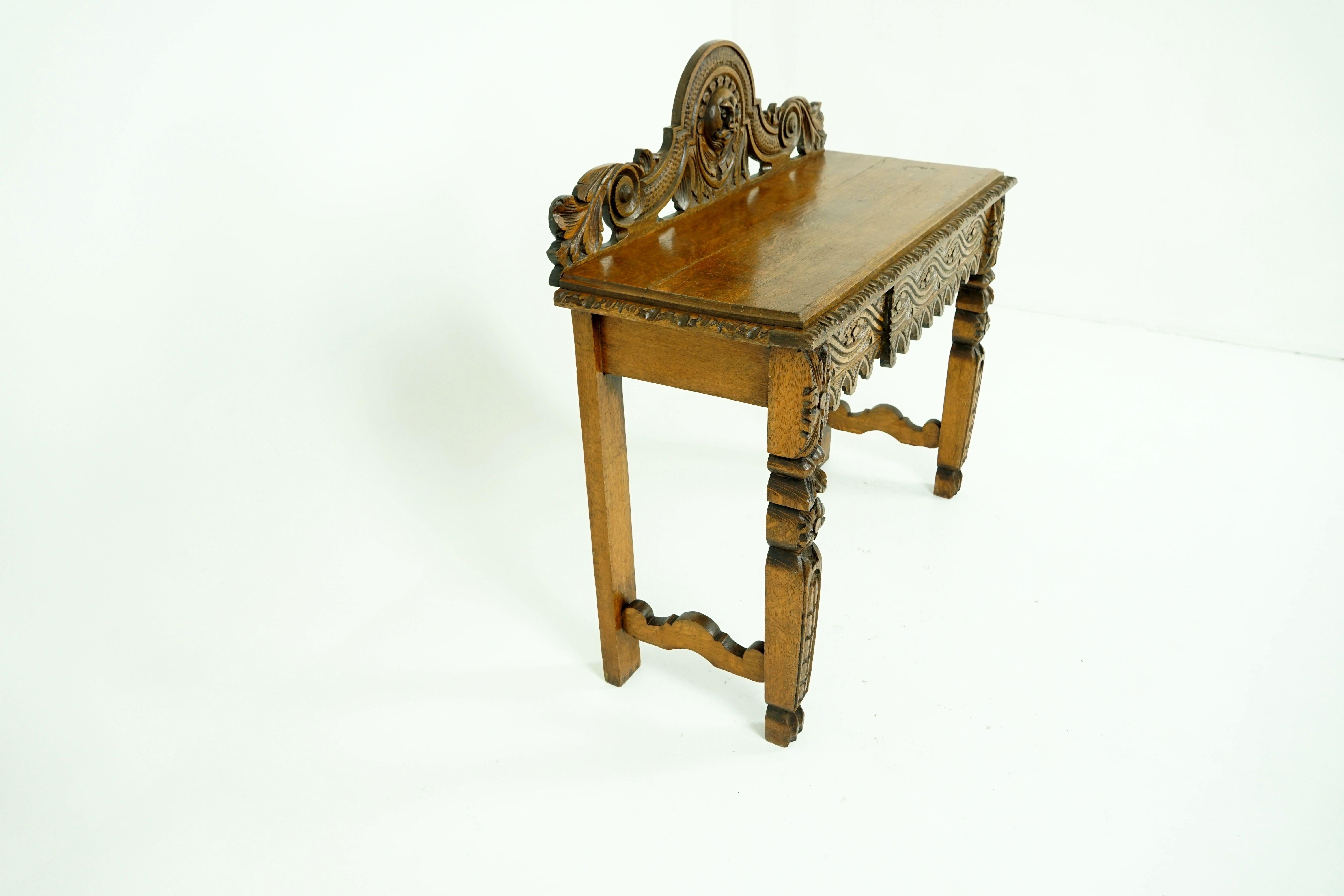 Antique oak hall table, Victorian carved oak side server table, antique furniture, Scotland, 1880, B1876

Scotland, 1880
Solid oak
Original finish
Top of the table is intricately carved with a head to the center
Floral carvings to the