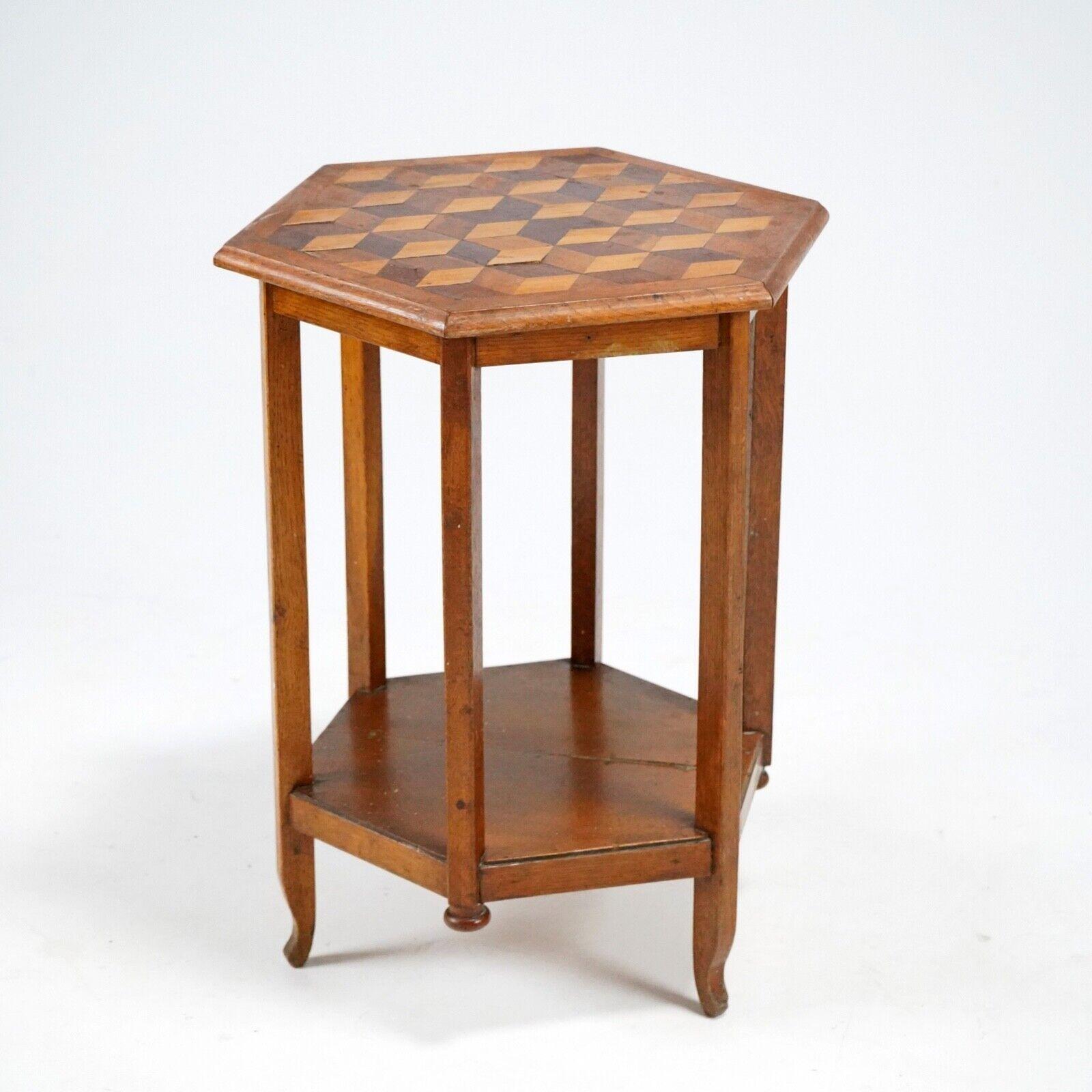 A charming hexagonal oak side table with cubist parquetry top. A refined piece that has a usual floating foot made from oak and believed to English made circa Late 19th Century. 

Condition 
Please do take a careful look at all our pictures and note